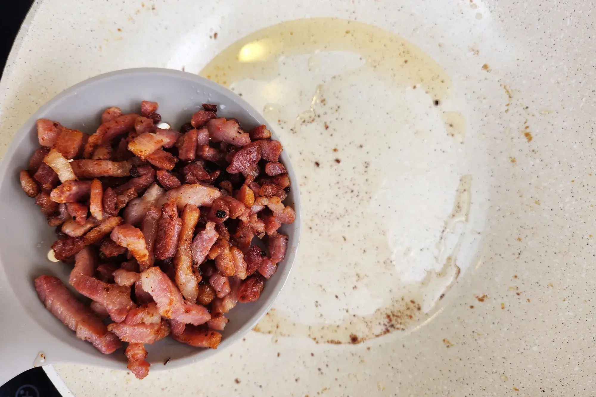 Scoop out the bacon and set it aside