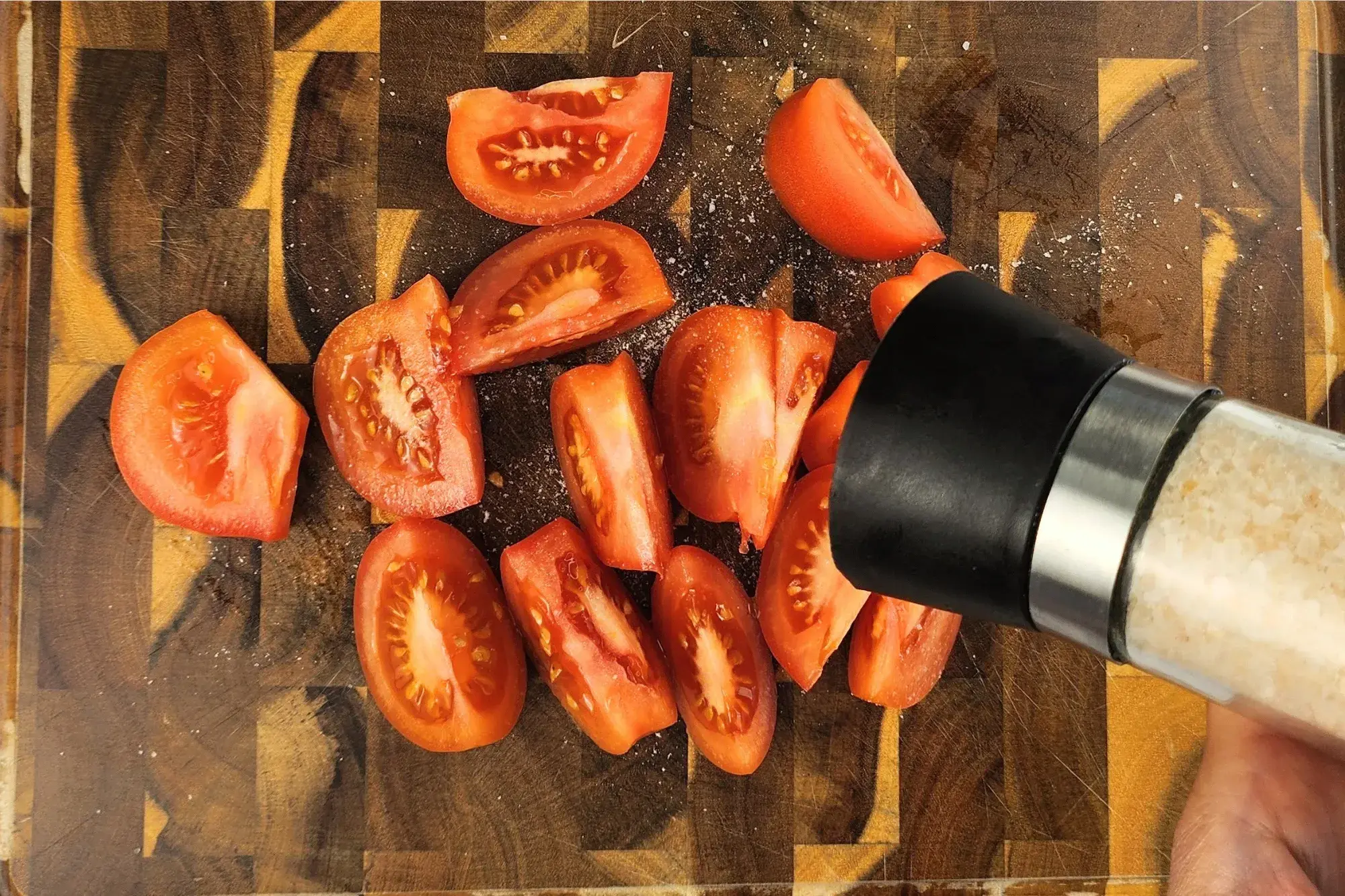 Season the tomato wedges with a little salt 
