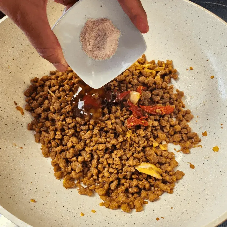 Adding salt to the pan