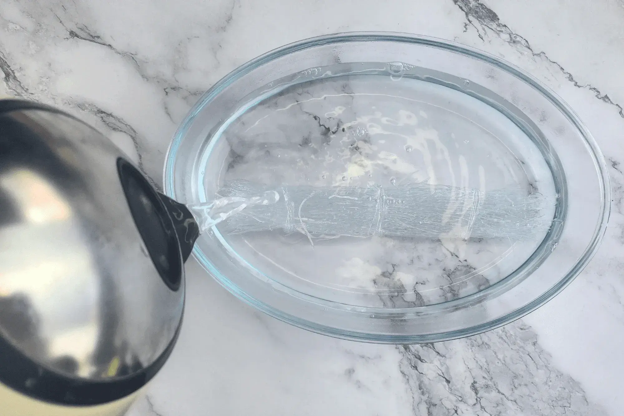 Soak the glass noodles until they soften 