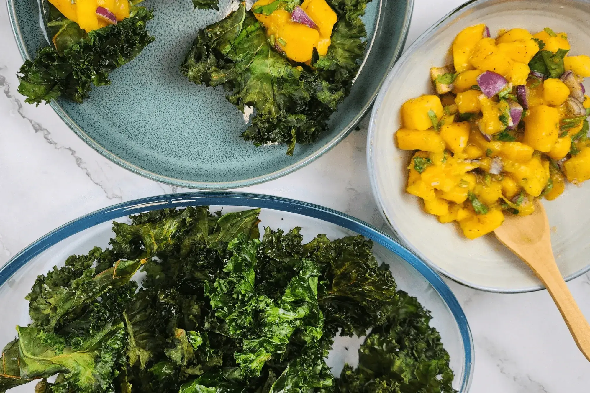 Spoon the mango salad over the crispy kale