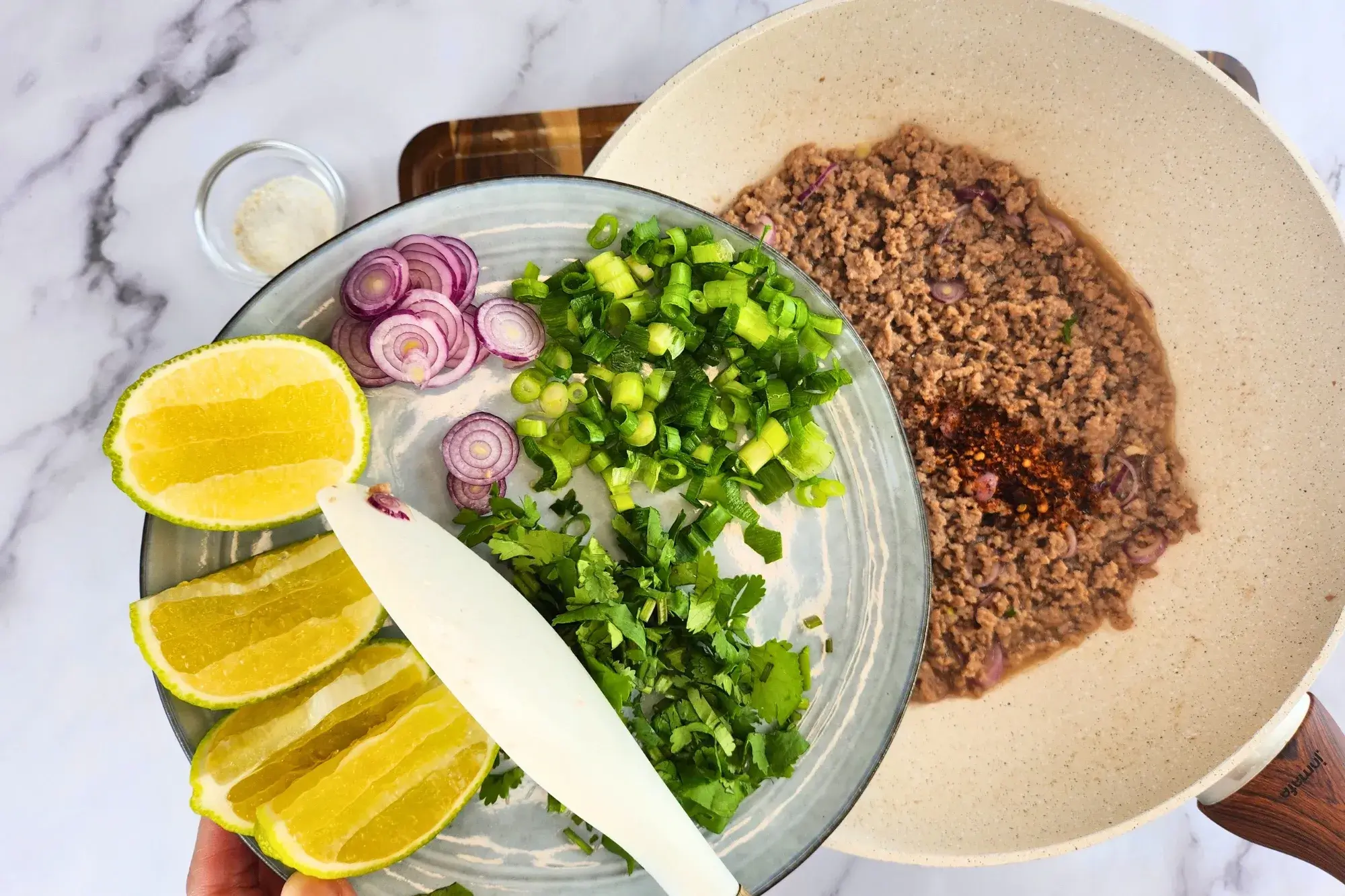 Stir in the green onions, shallots 