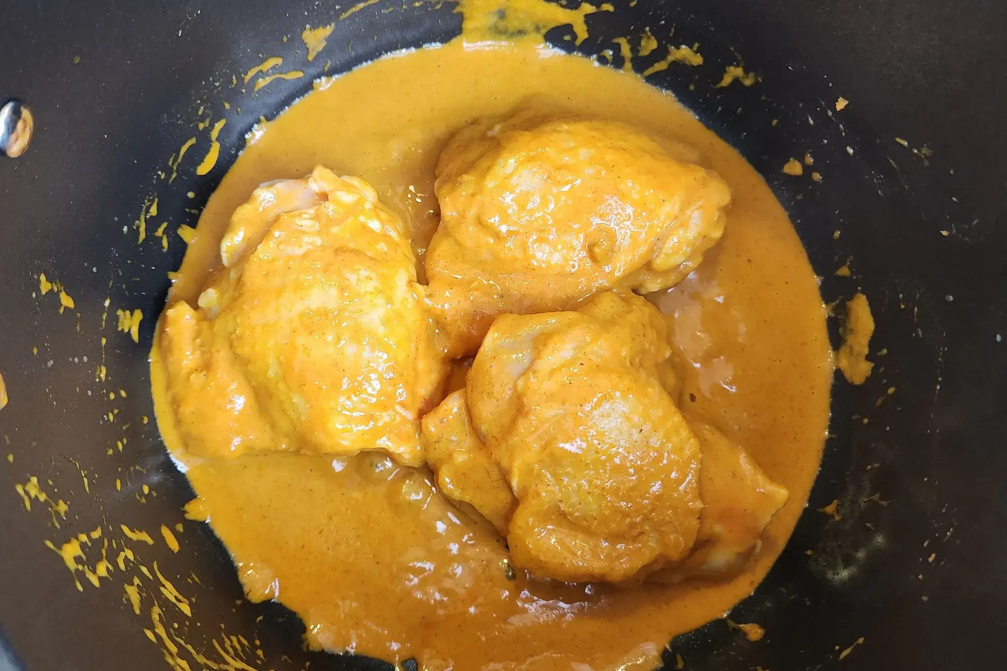 Stir to coat them in the curry paste mixture