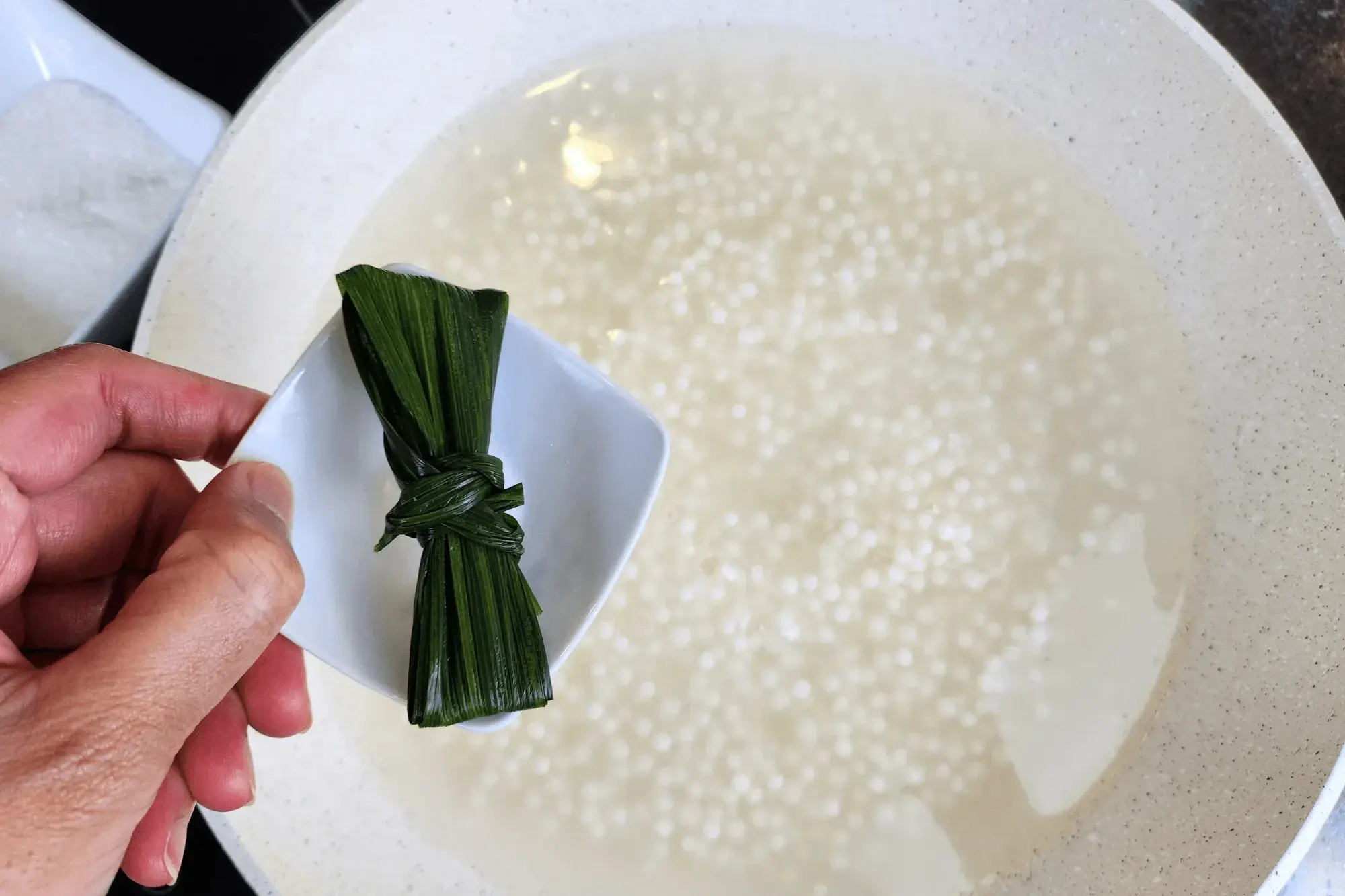Then, add folded pandan leaves - sago