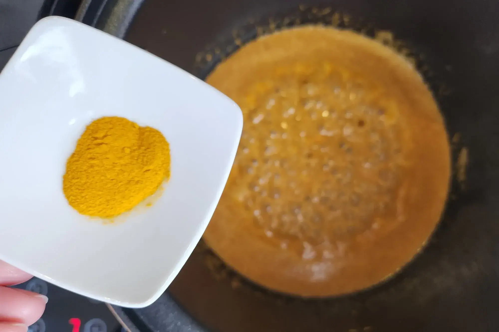 Then add turmeric powder