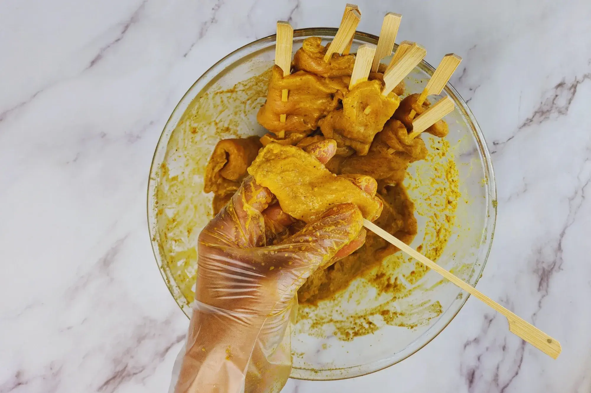 Thread the marinated pork onto skewers.