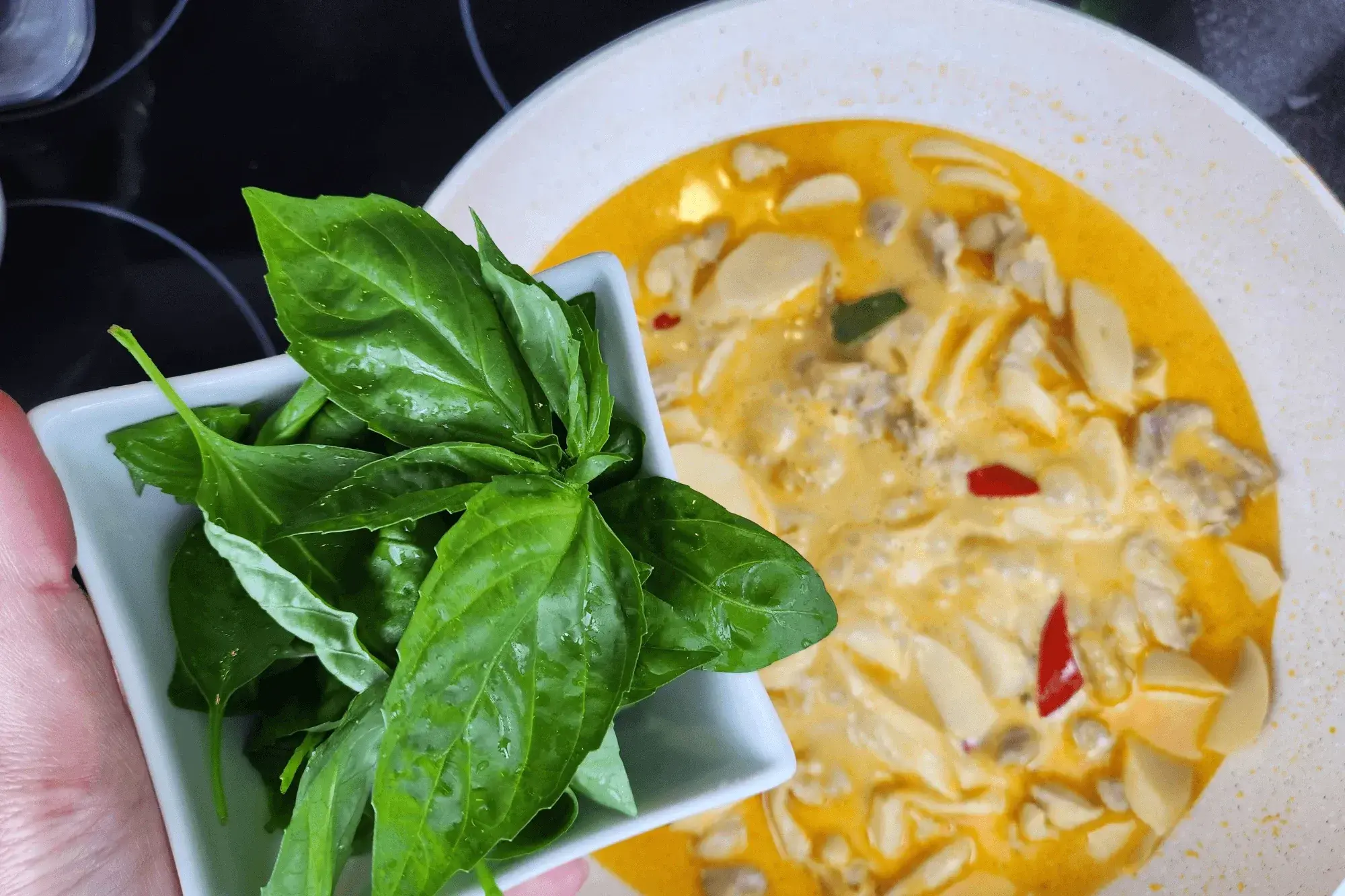 Toss in the basil leaves