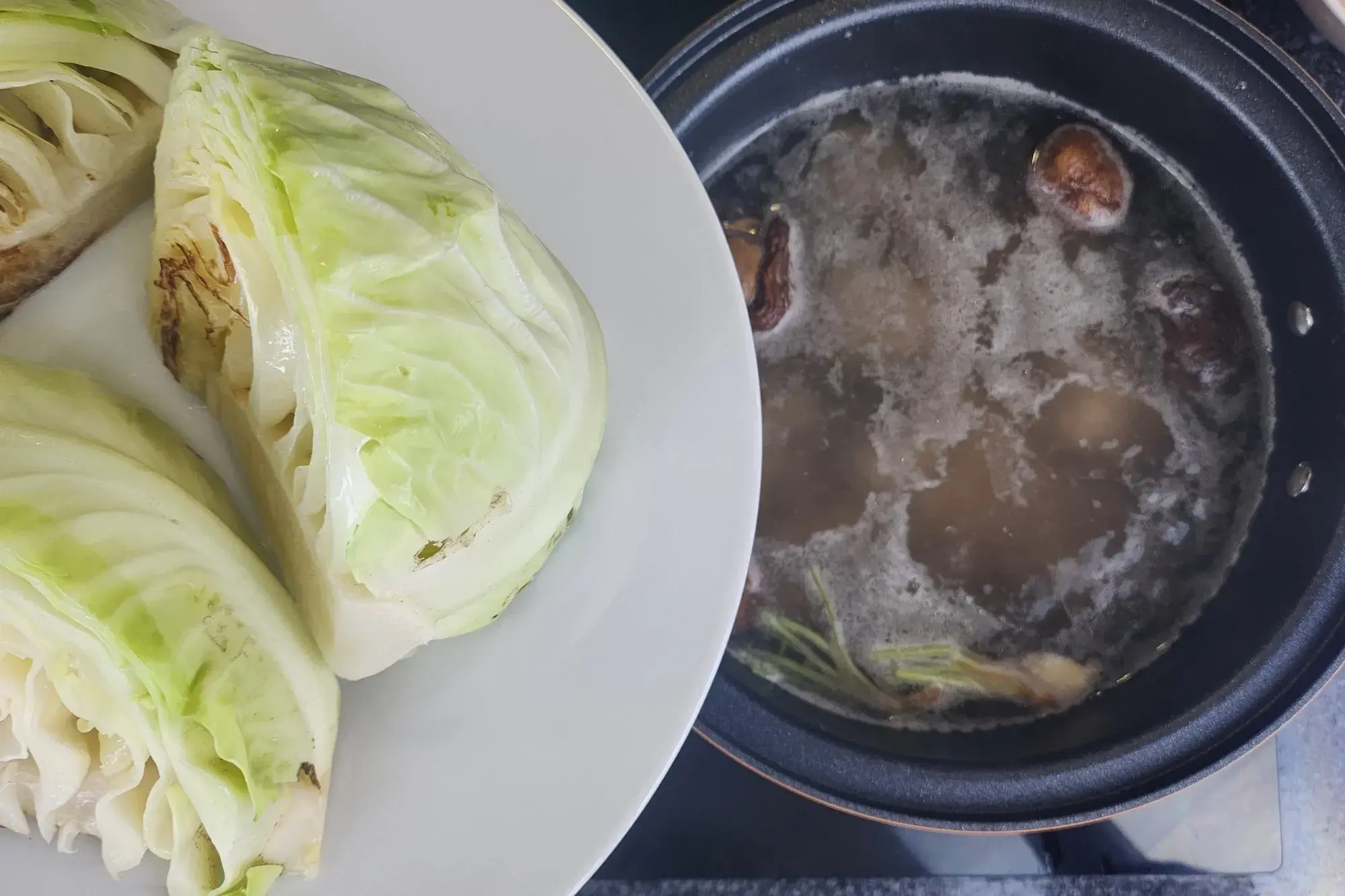 Transfer the seared cabbage into the pot.