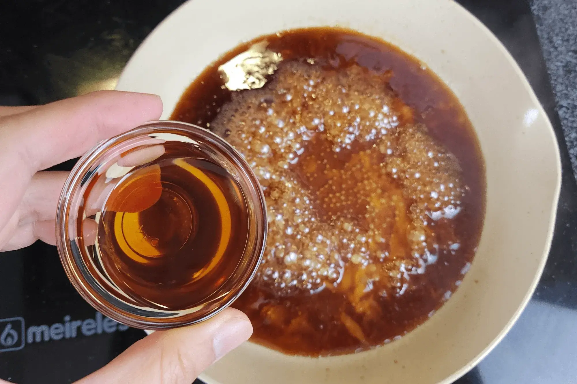 Using the same pan, combine soy sauce, oyster sauce, sesame oil,