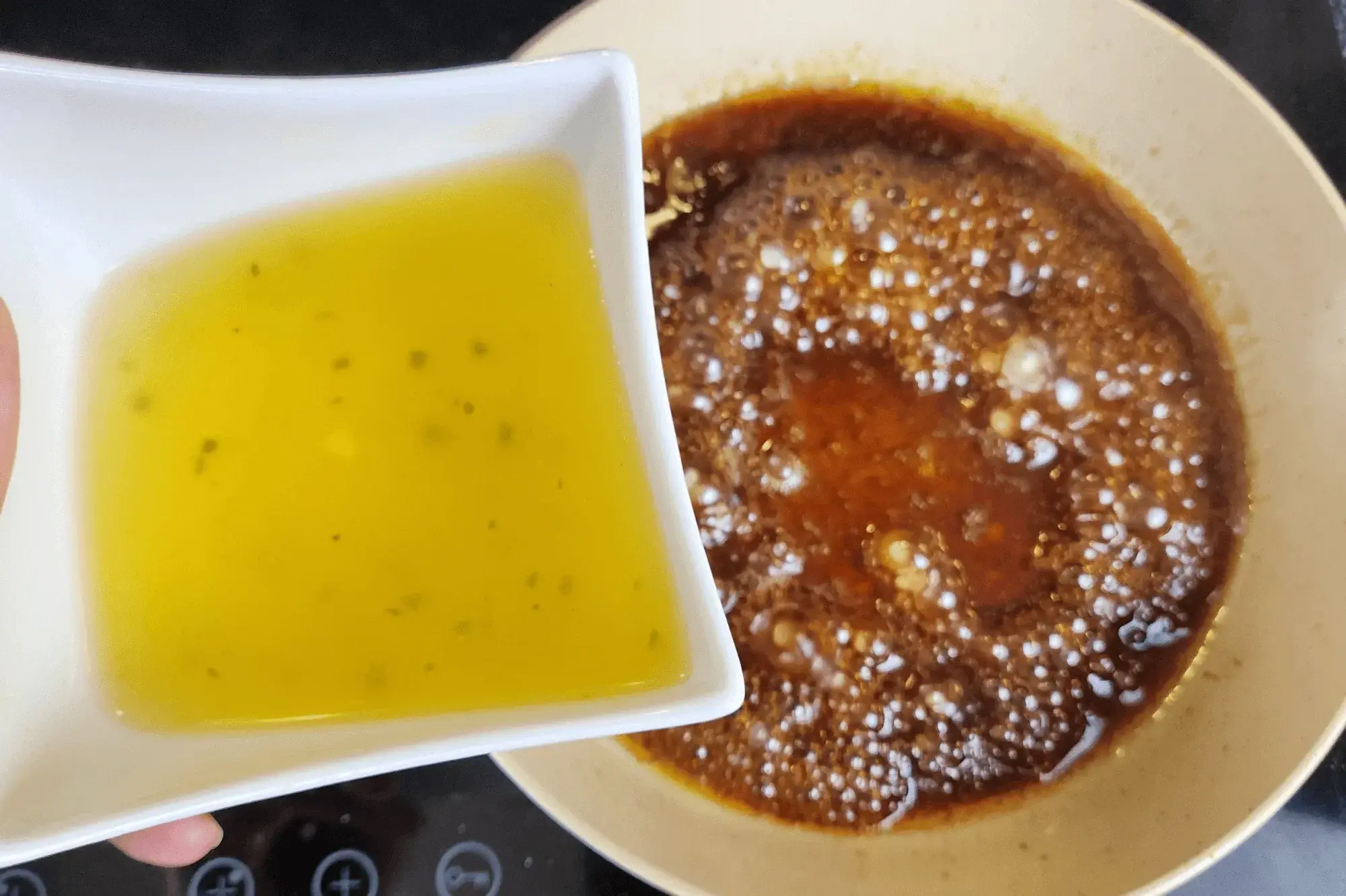 Using the same pan, combine soy sauce, oyster sauce, sesame oil, and broth. 
