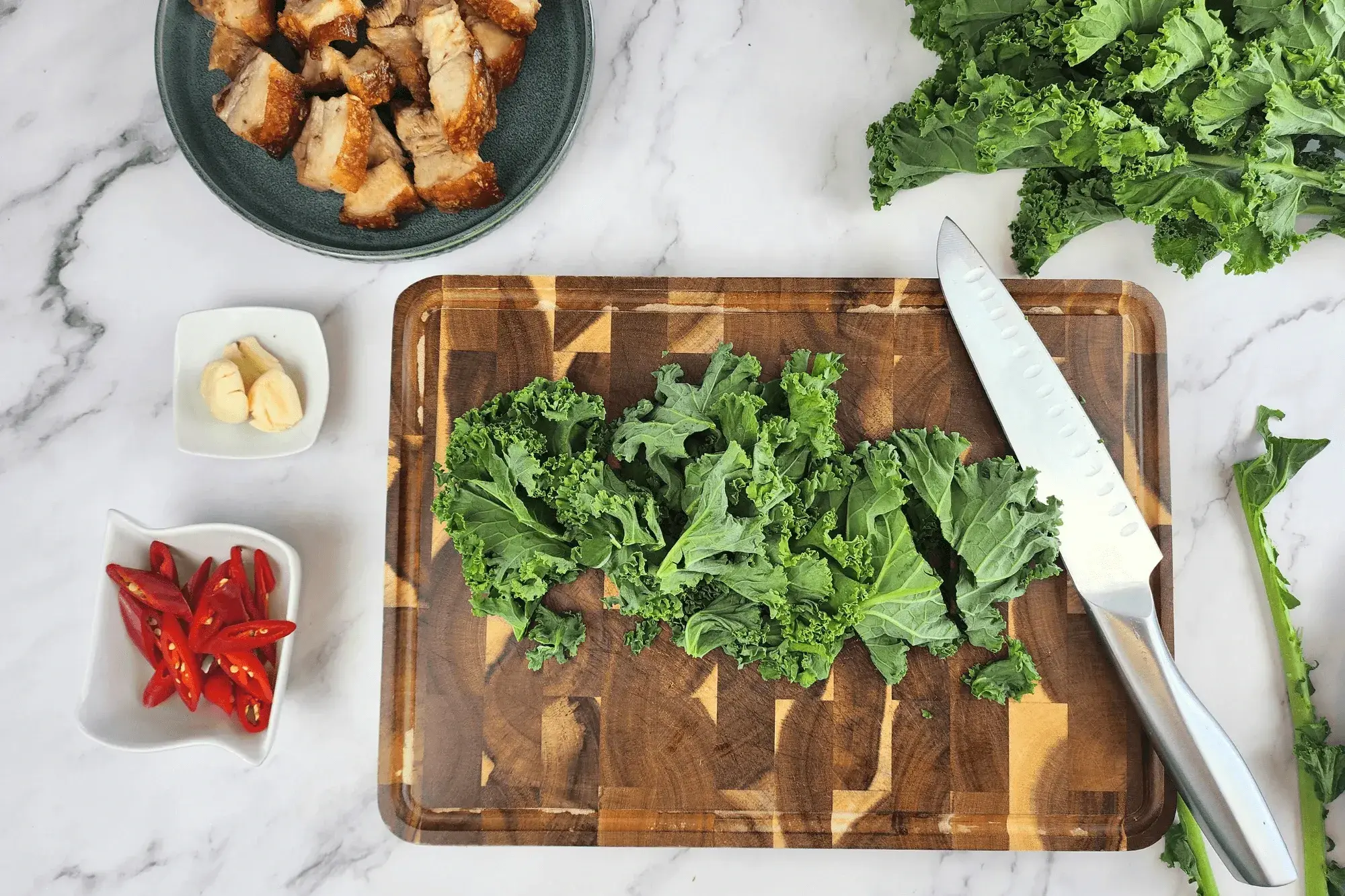 Wash the kale thoroughly, drain, and cut it into bite-sized pieces.