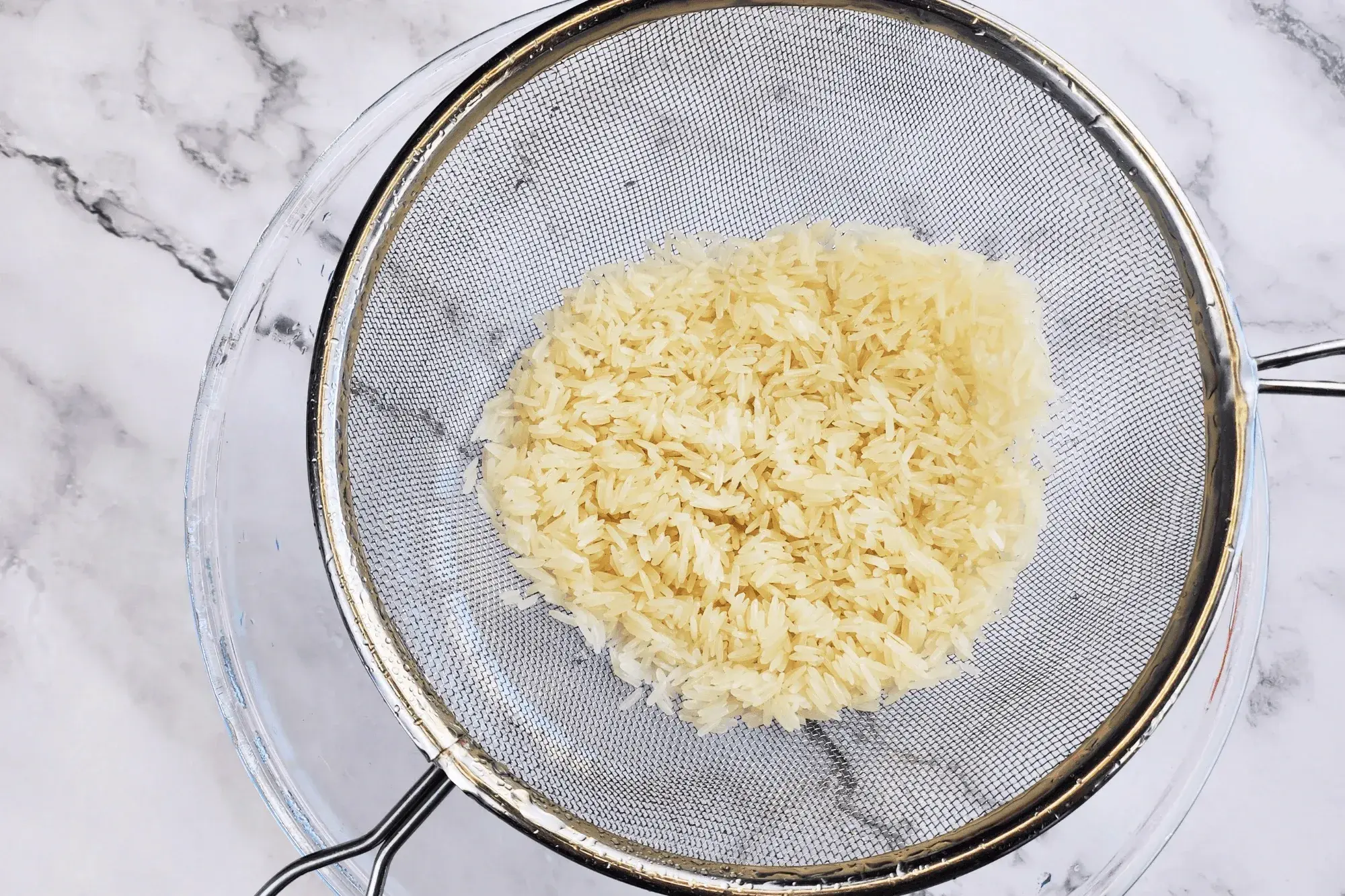 Wash the uncooked rice until the water runs clear. Drain well.