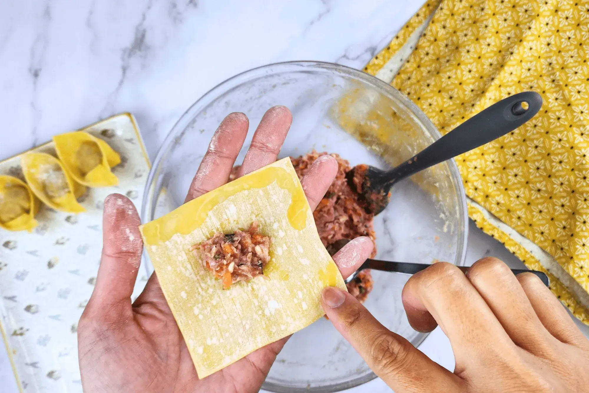 Wet the edges of wrapper with water
