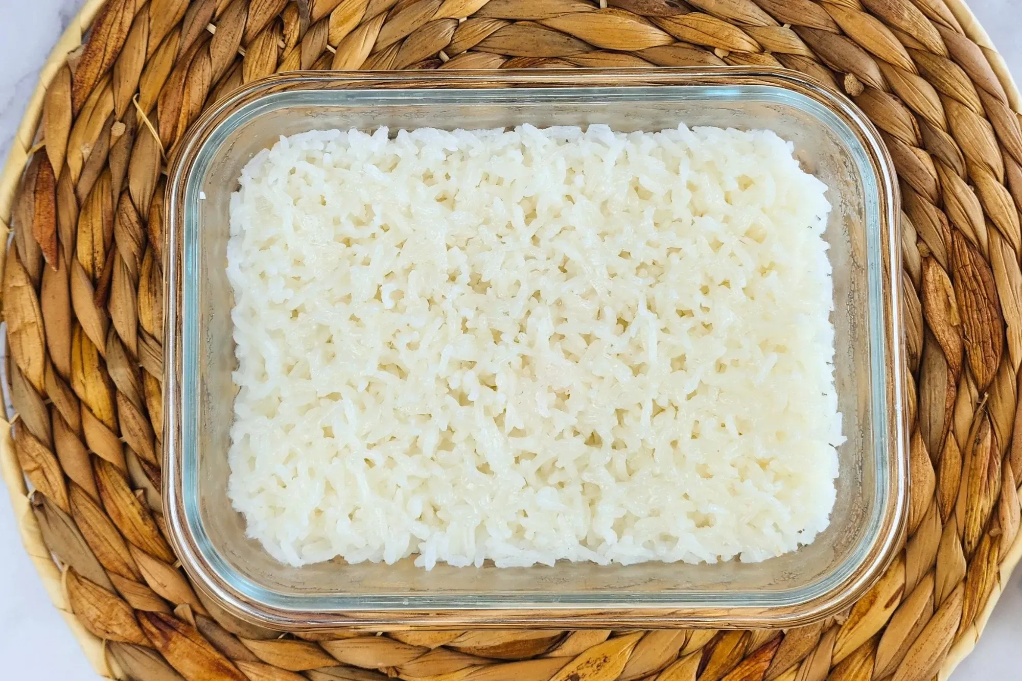 A container of cooked Thai Jasmine Rice.