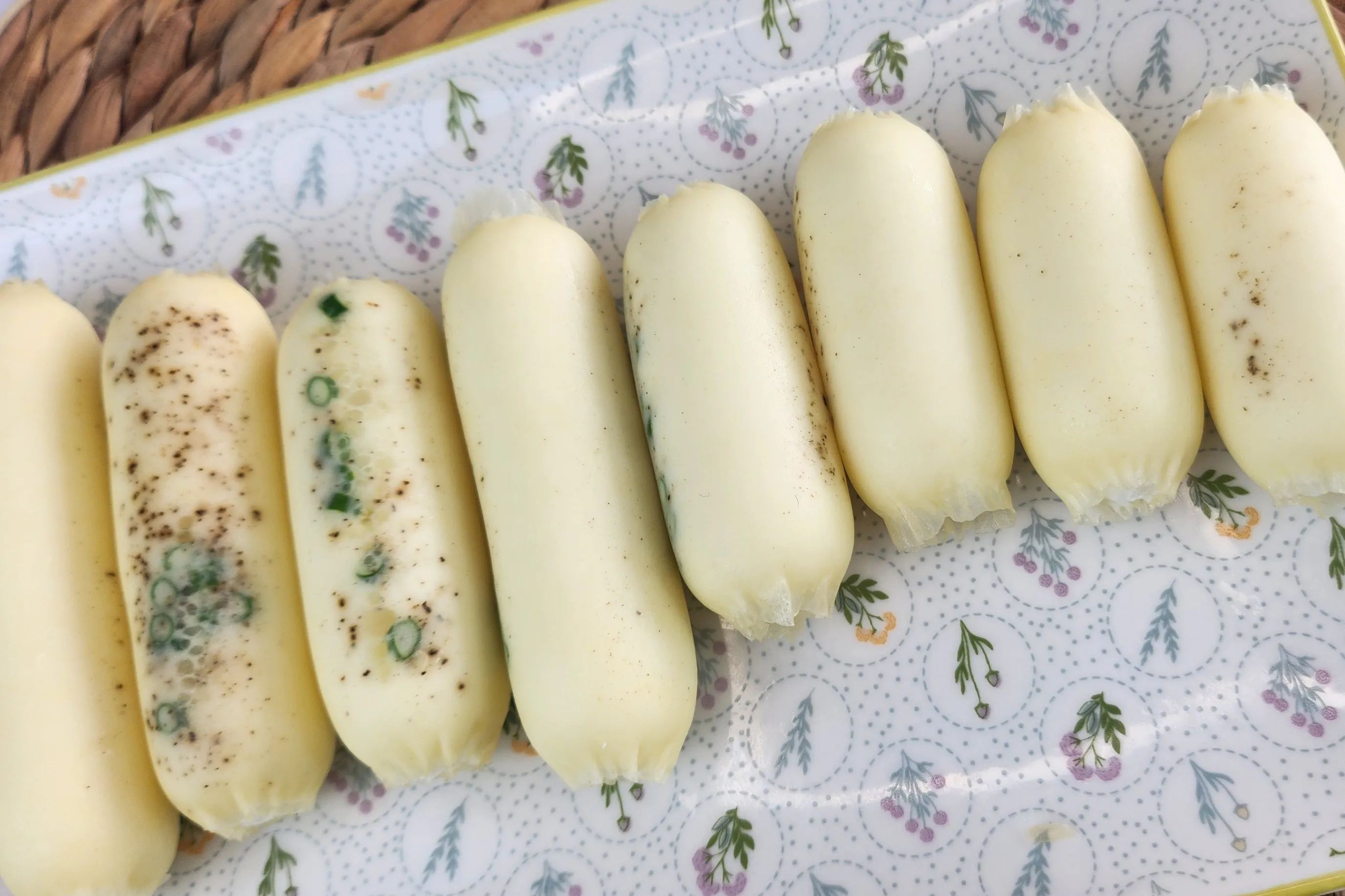 A plate of cooked egg white sausages