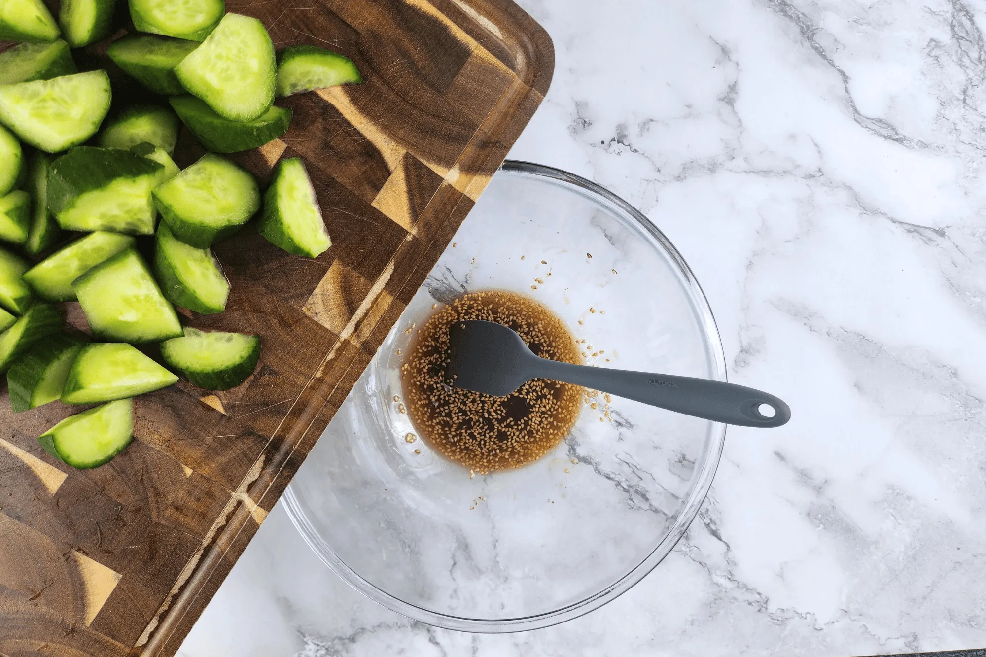 Add cut cucumber pieces into mixed dressing.