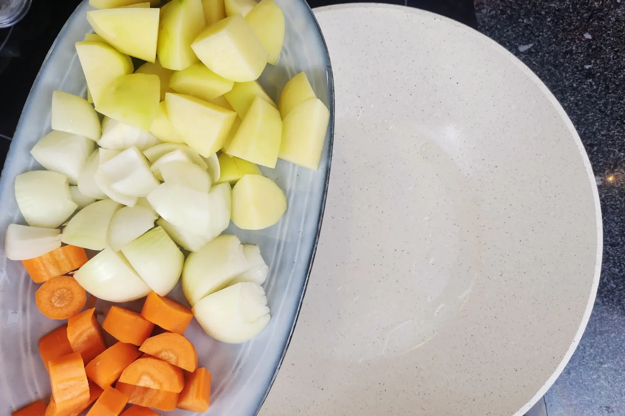 Add the chopped onions, potatoes, and carrots.