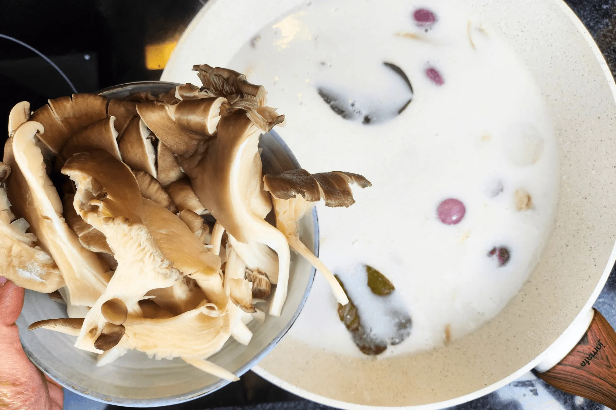 Add the oyster mushrooms to the pot and let them cook until softened.