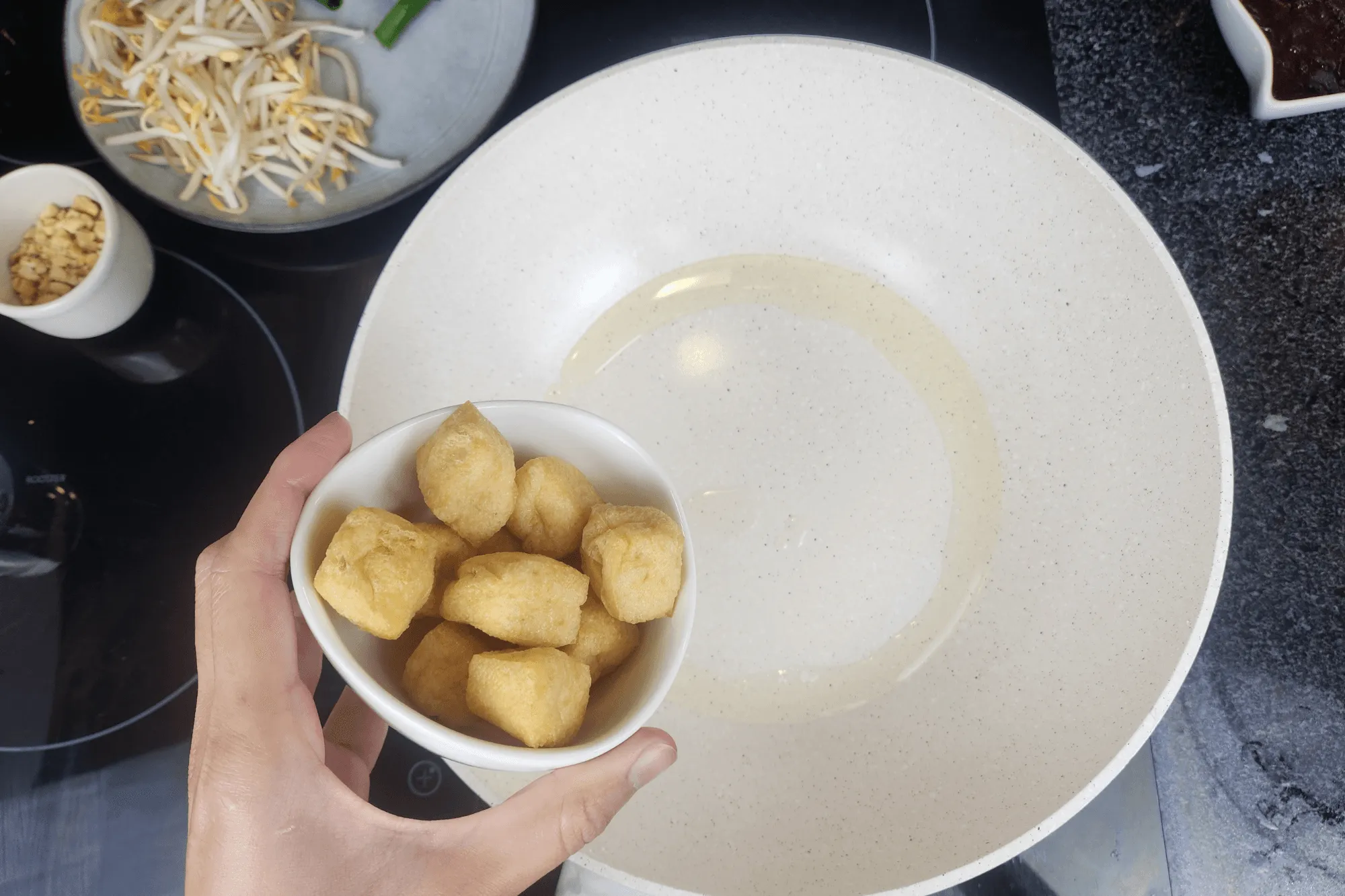 Add tofu, stir-fry until it is golden and slightly crispy