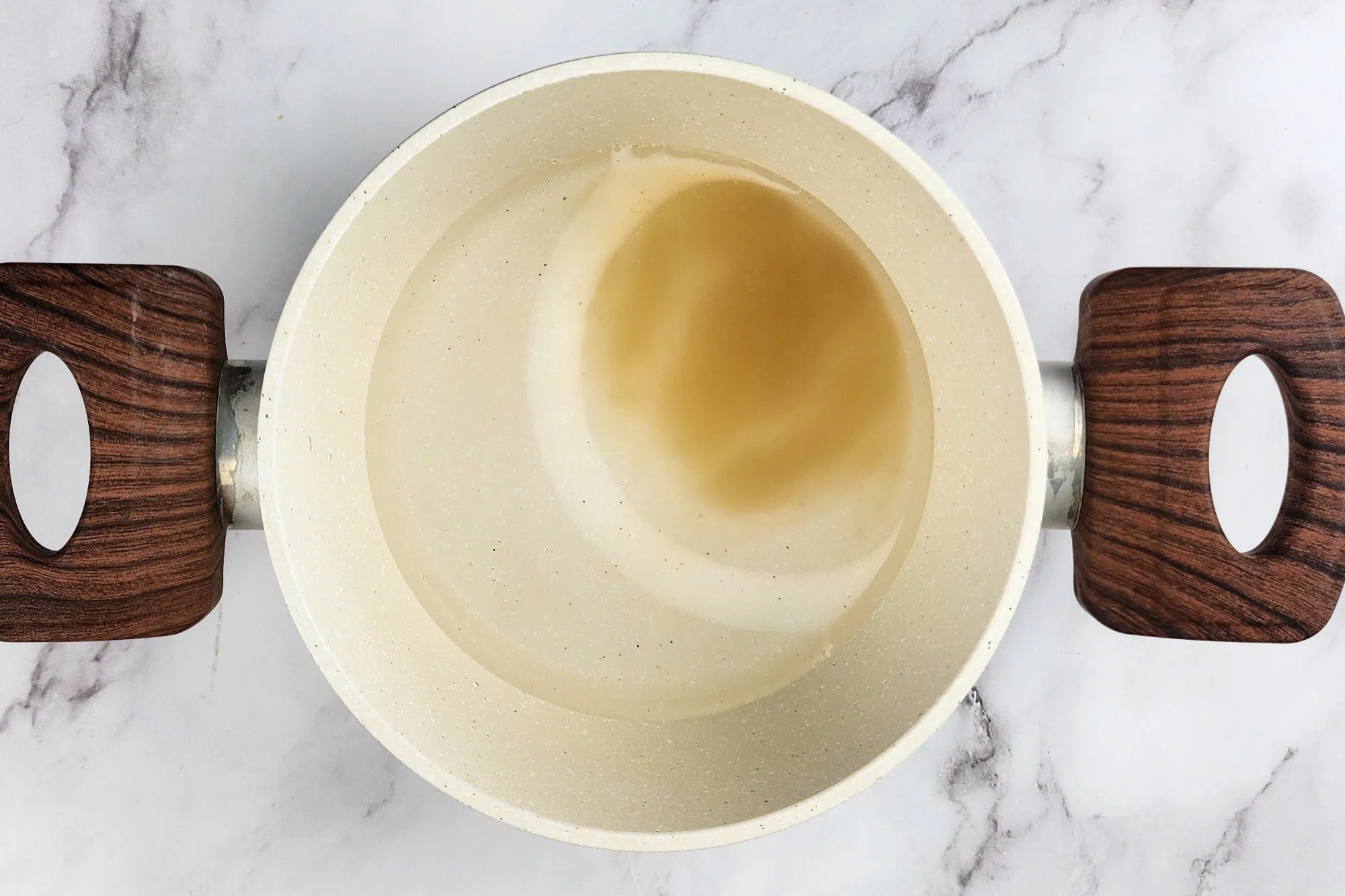 Agar powder in a pot of water
