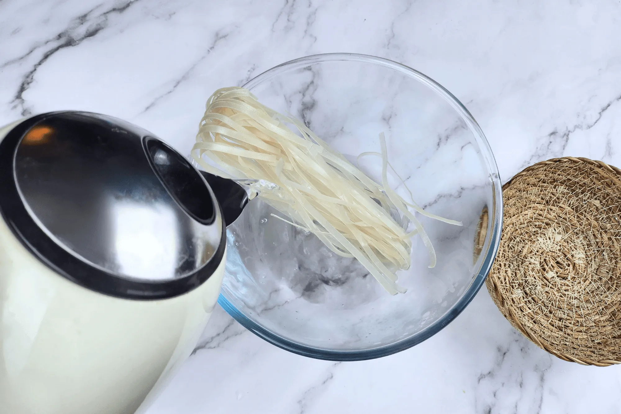 Boil/soak the rice noodles in boiling water 