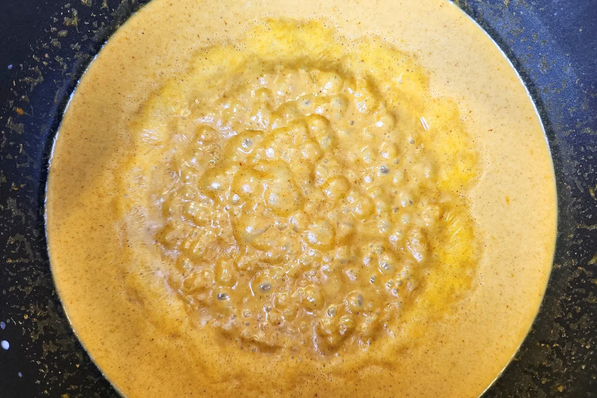 Boiling curry sauce in the pot.