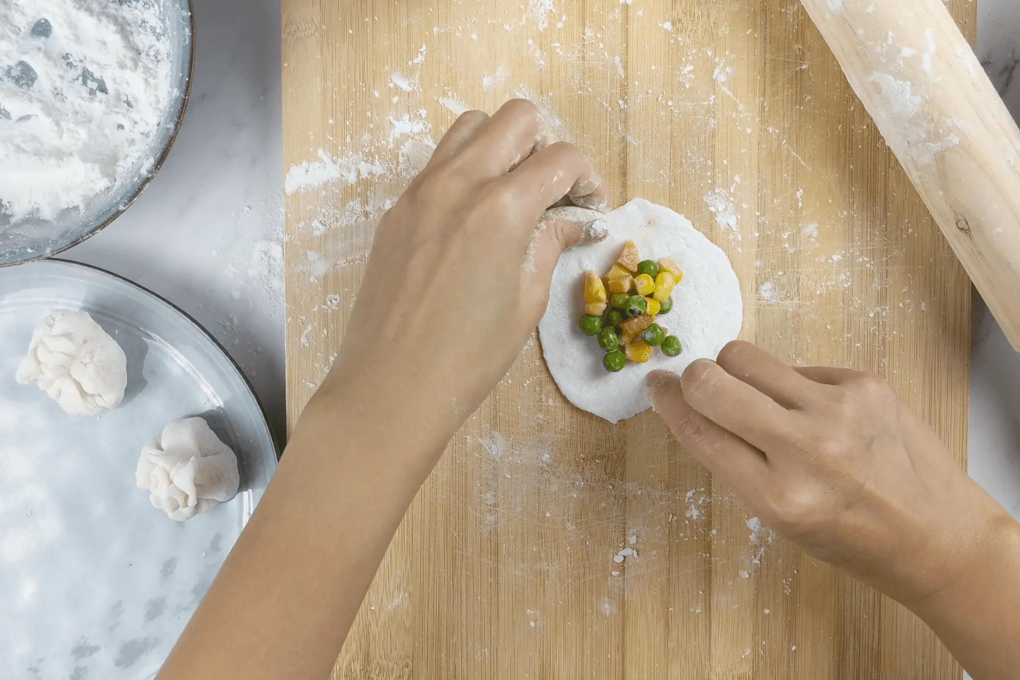 Bring the edges of the dough together above the filling