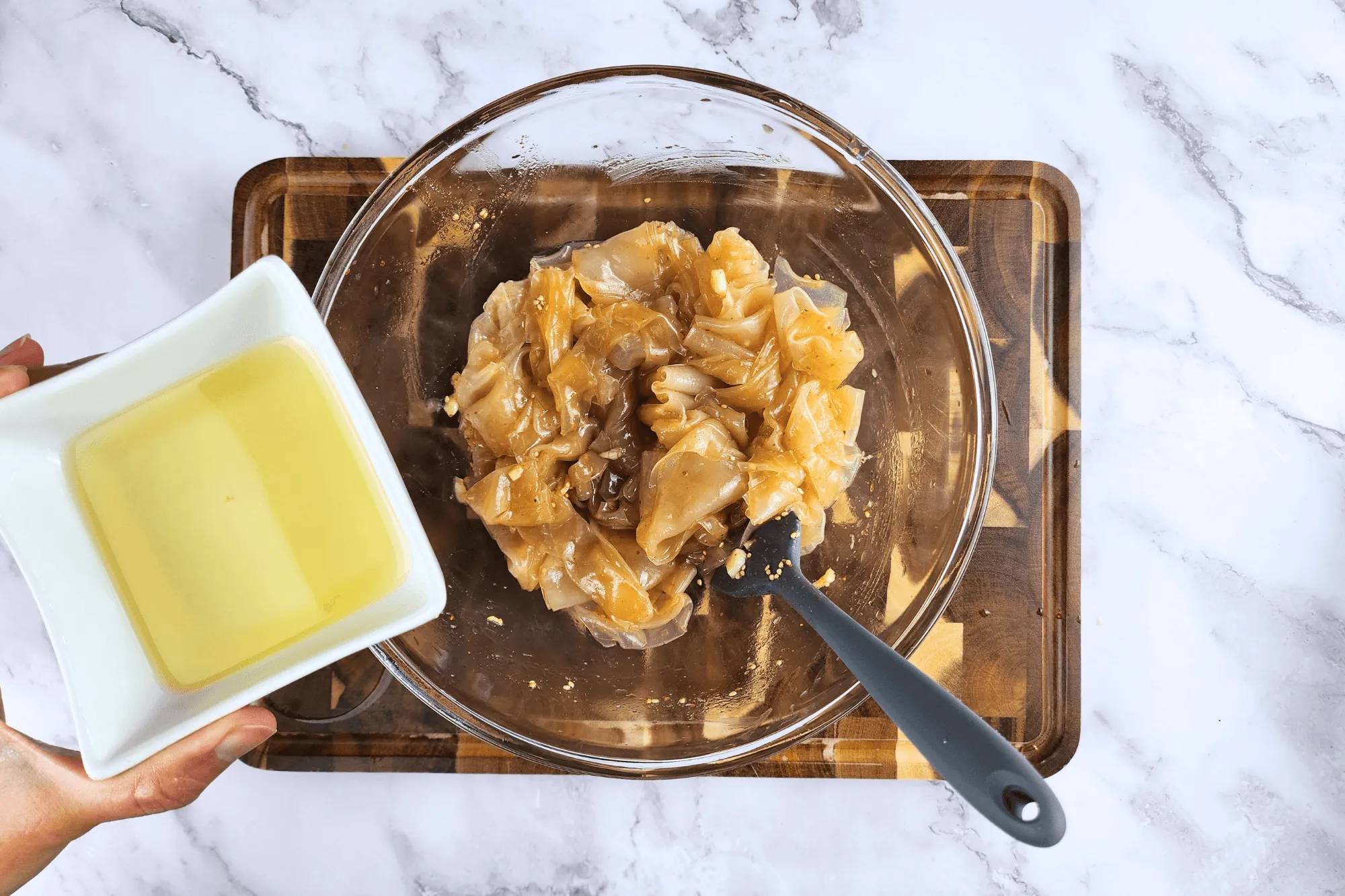 Carefully pour the hot oil over the dressing mix in the bowl 