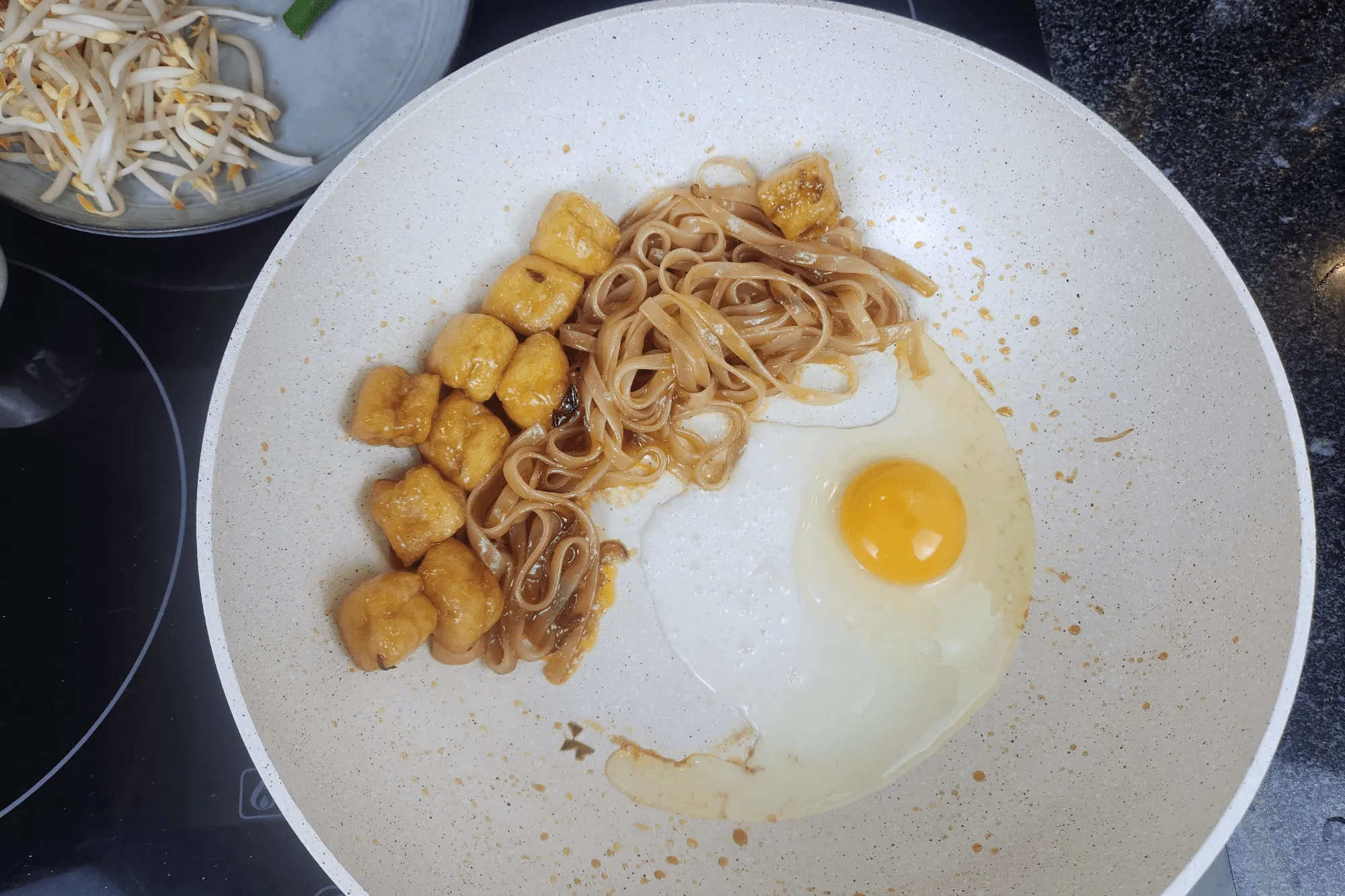  crack an egg into the pan