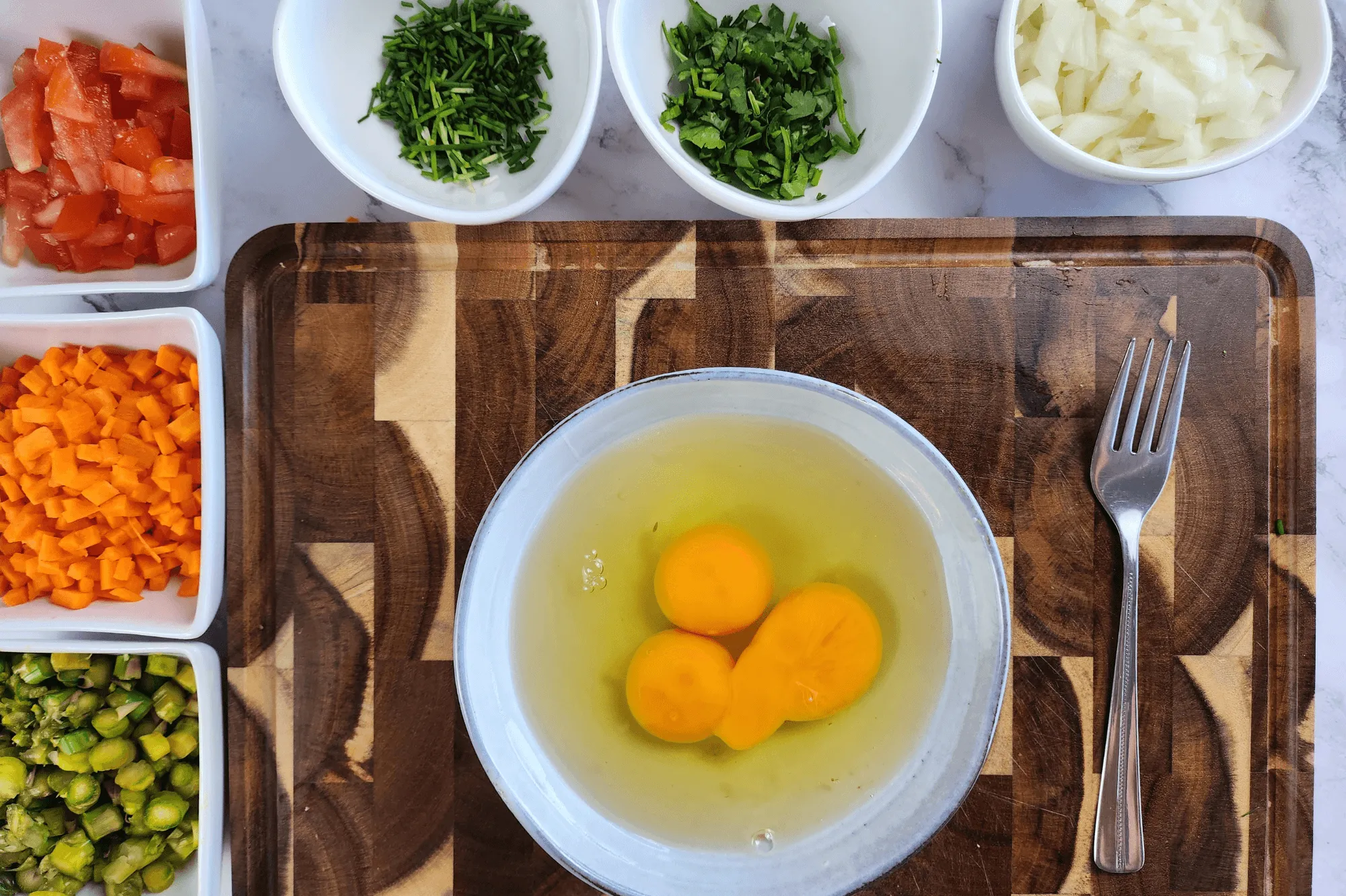 Crack the eggs into a bowl and whisk until smooth.