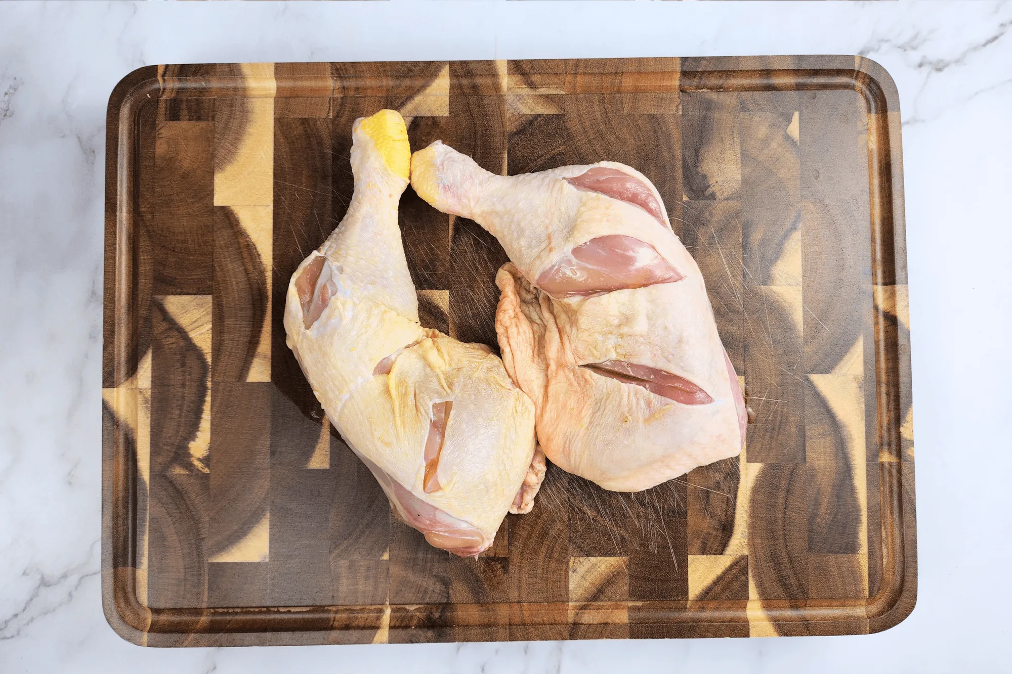 Cut slits in the chicken close to the bones to allow the marinade to penetrate the chicken.