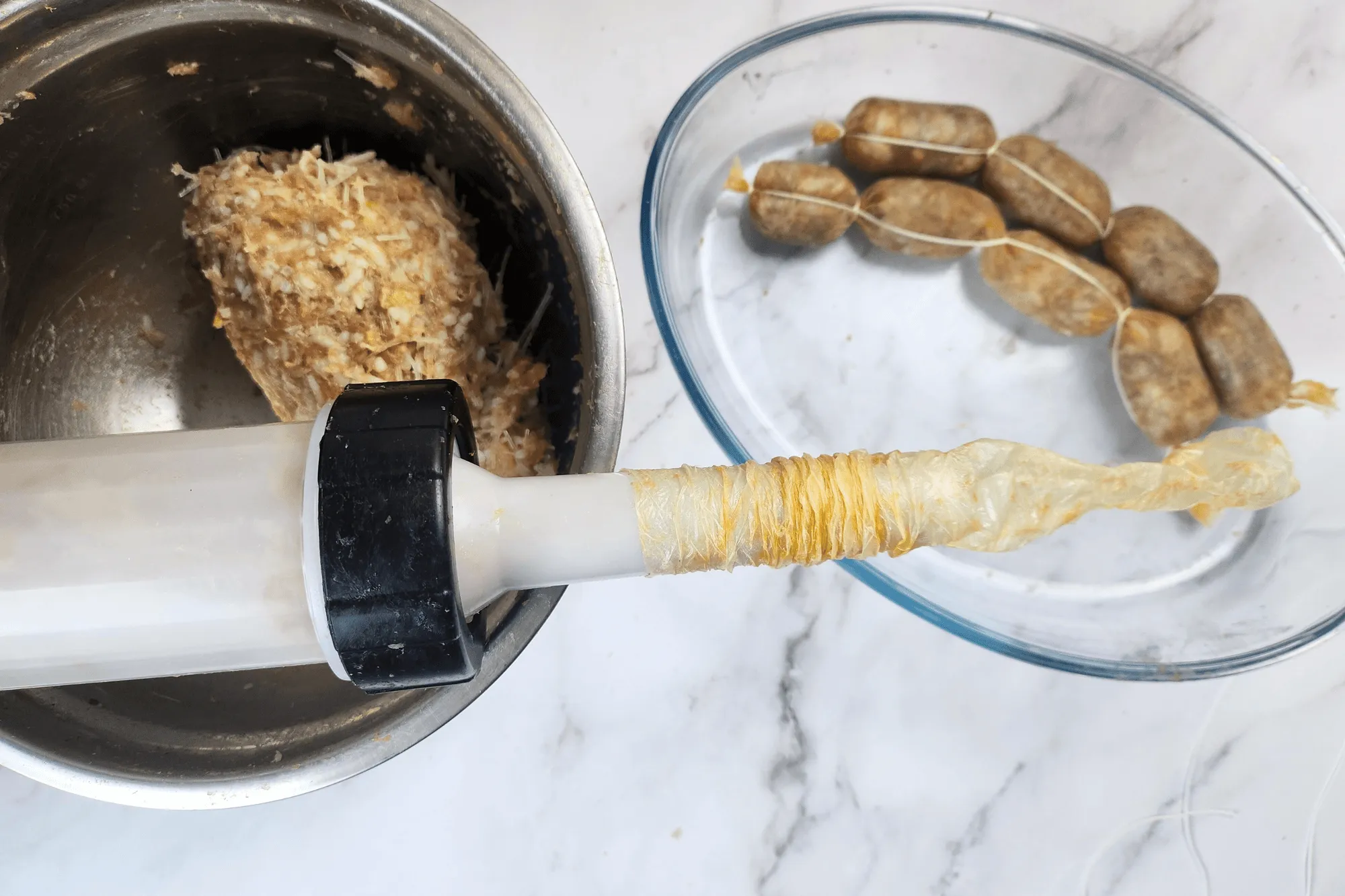 Fill the sausage casing with the mixture. Tie the casing into sections with string or twist the casing to create links of your desired size. If you don't have string, twisting and pinching the casing will hold it in place.