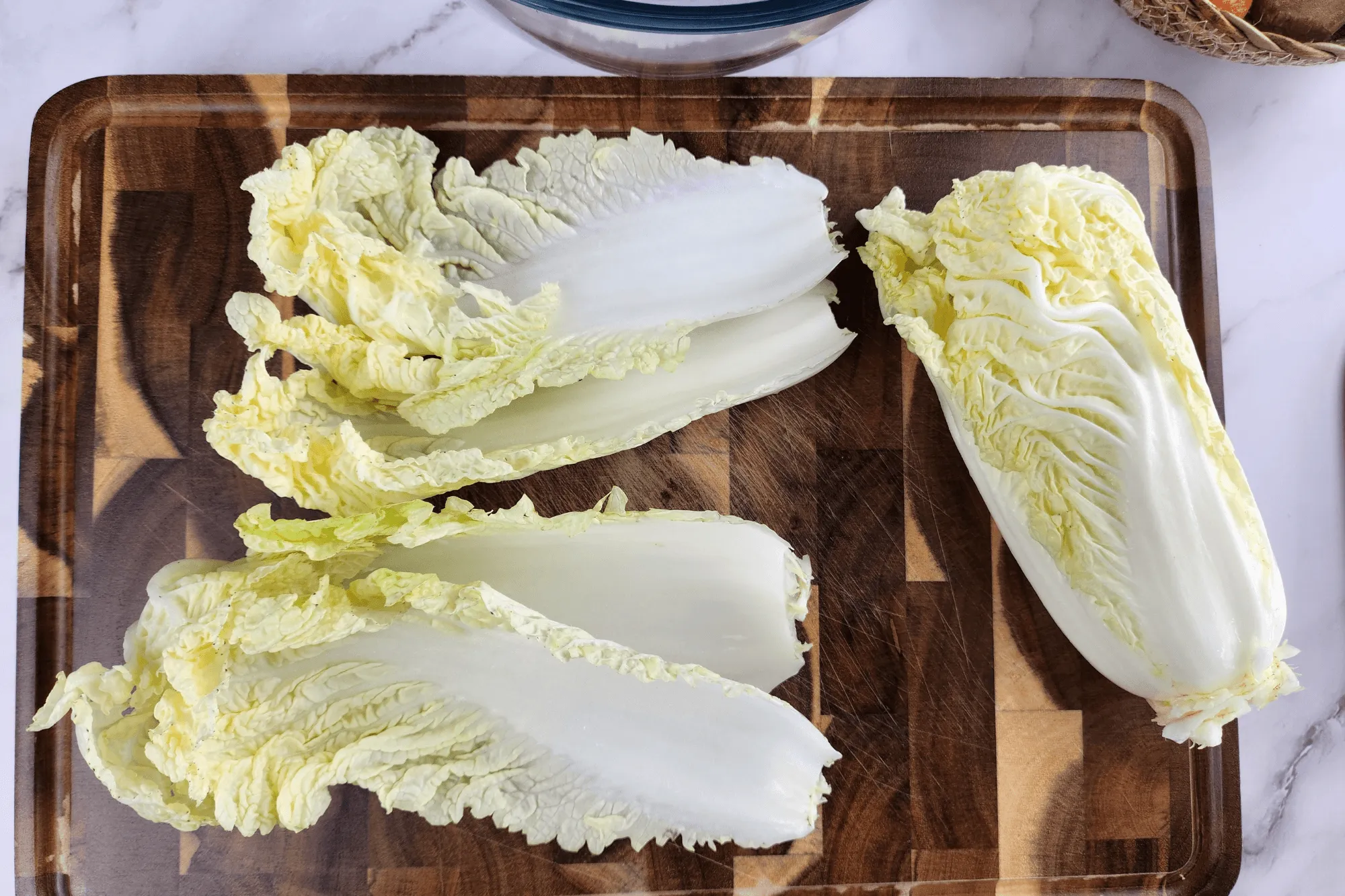 Gently separate the cabbage leaves one by one and cut off the tough stem ends