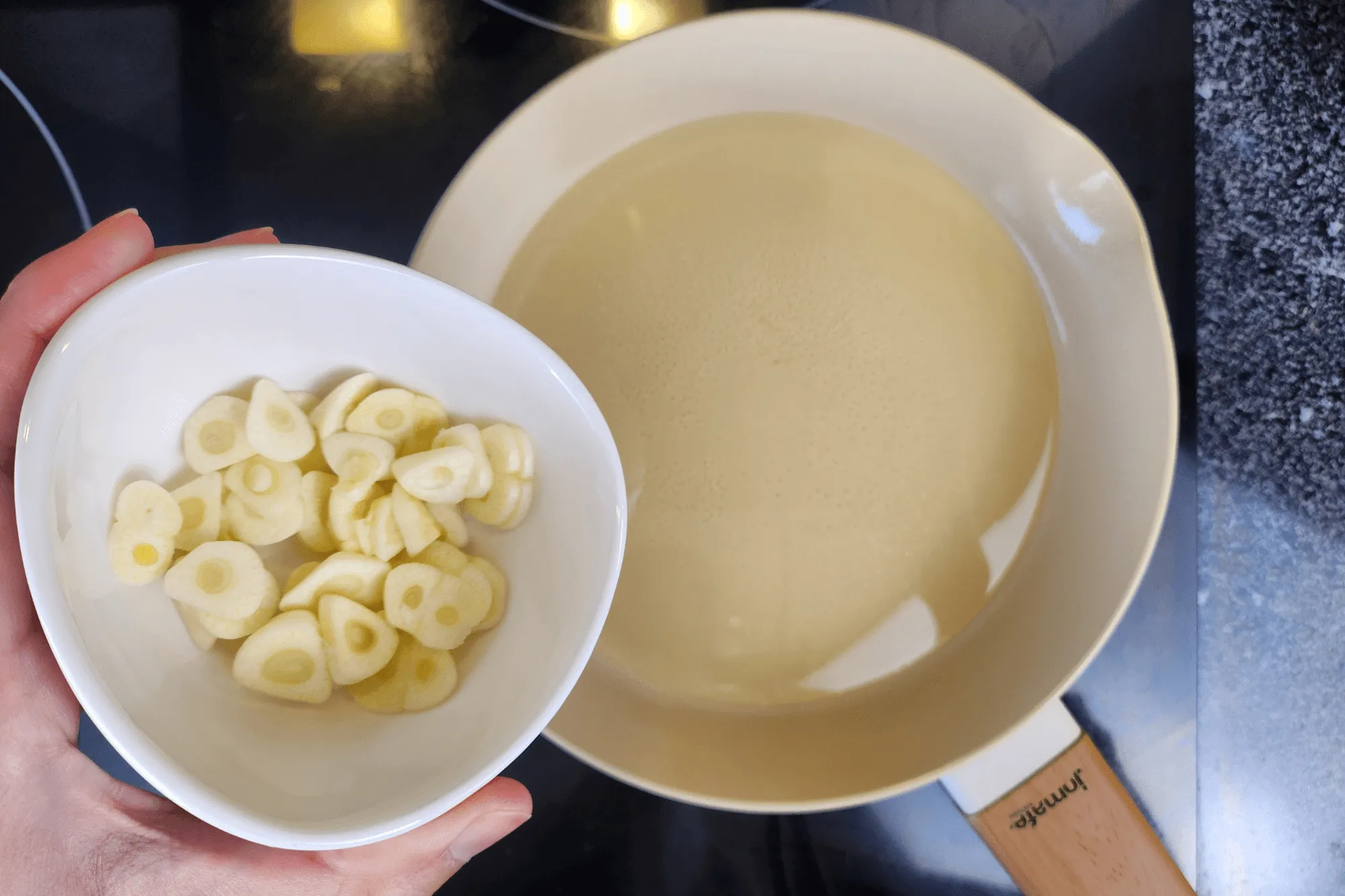 Heat a pan and fry the sliced garlic until golden and crispy. 