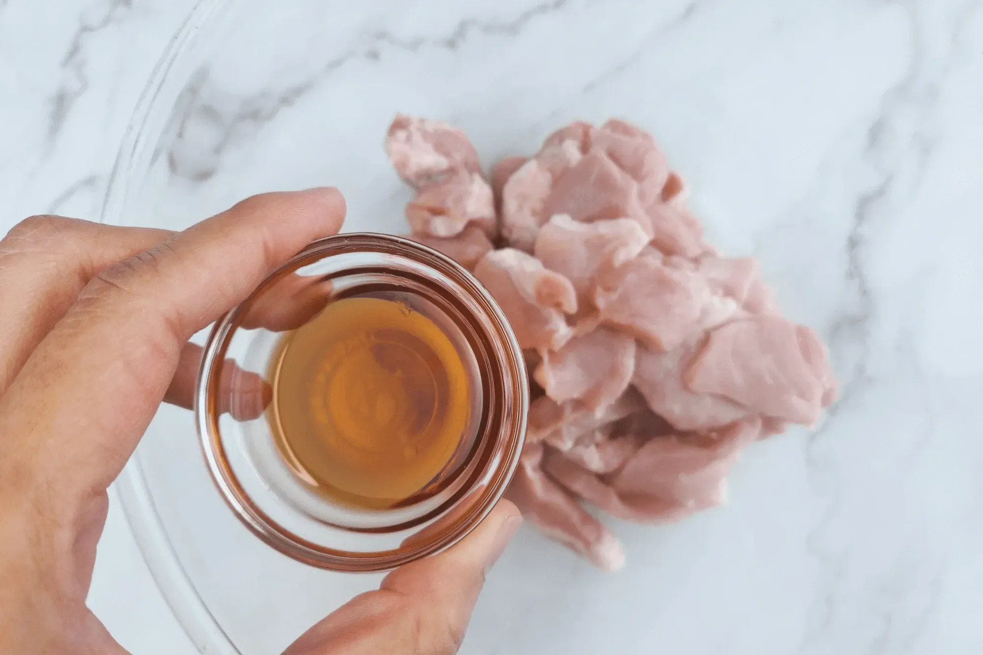 In a bowl, add sliced pork mix with grated ginger, mirin, sugar and soy sauce 
