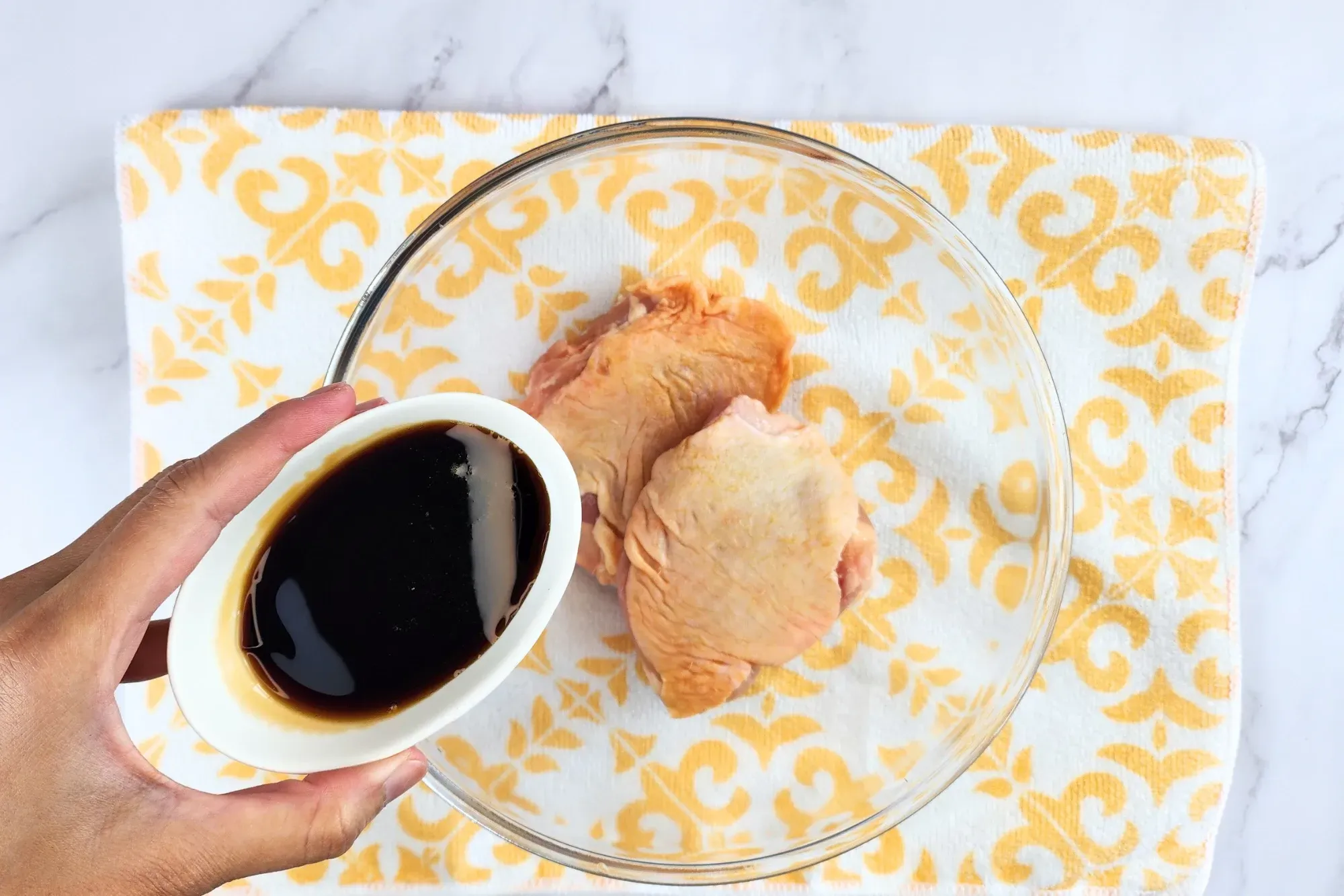 In a bowl or zip-top bag, combine chicken with 2 tablespoons of teriyaki sauce per piece.