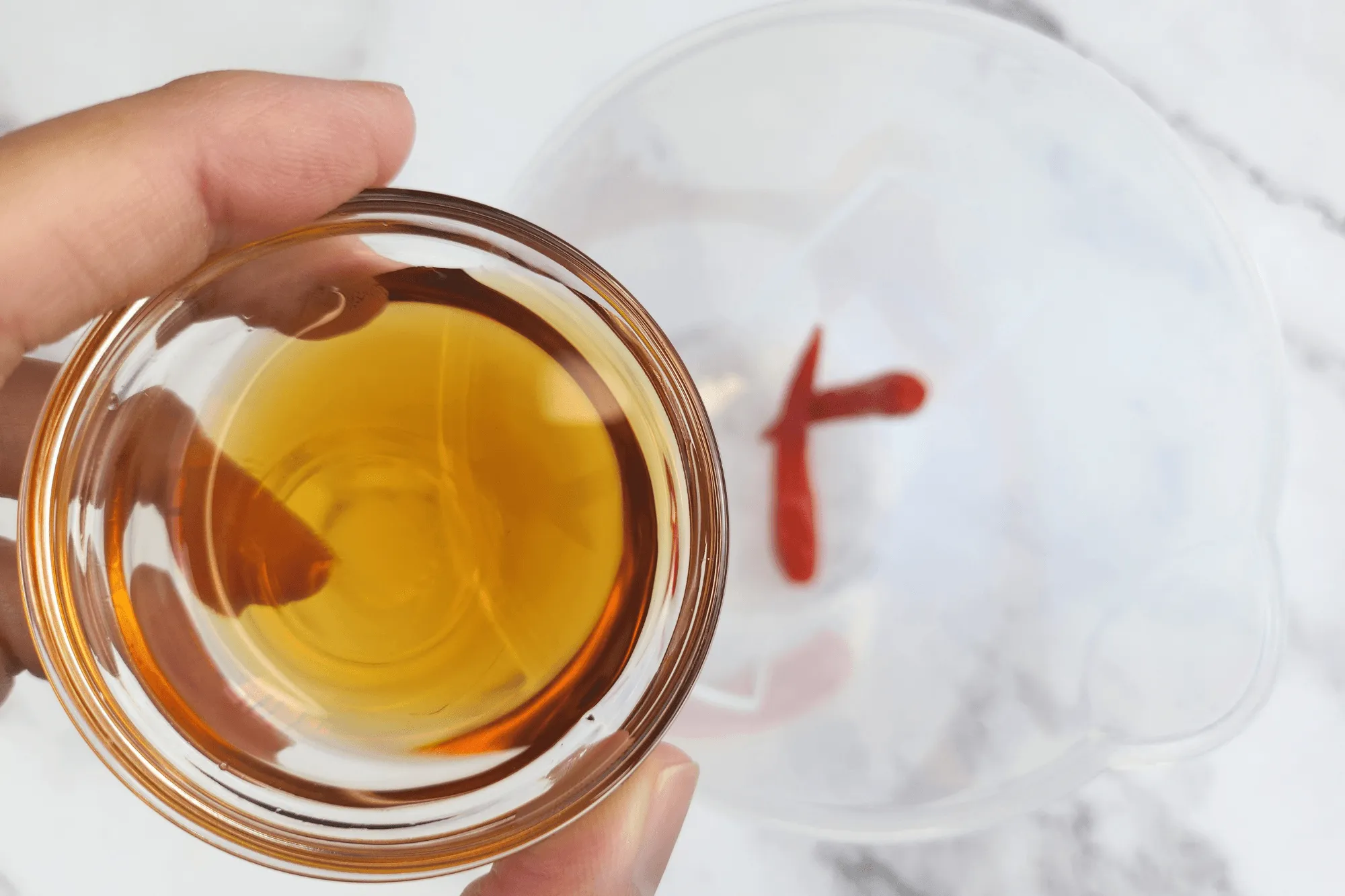 In a cup, combine red bird’s eye chilies, fish sauce