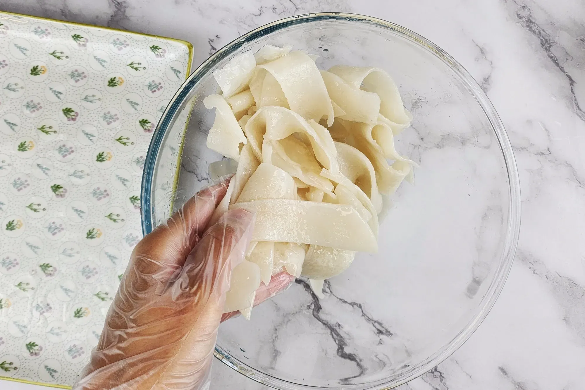 In a separate bowl, combine the wide rice noodles