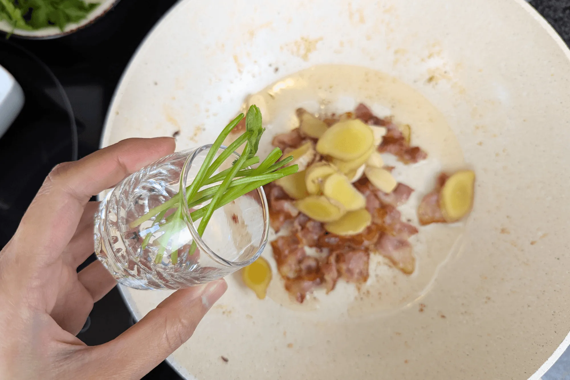 In the same pan, sauté coriander root