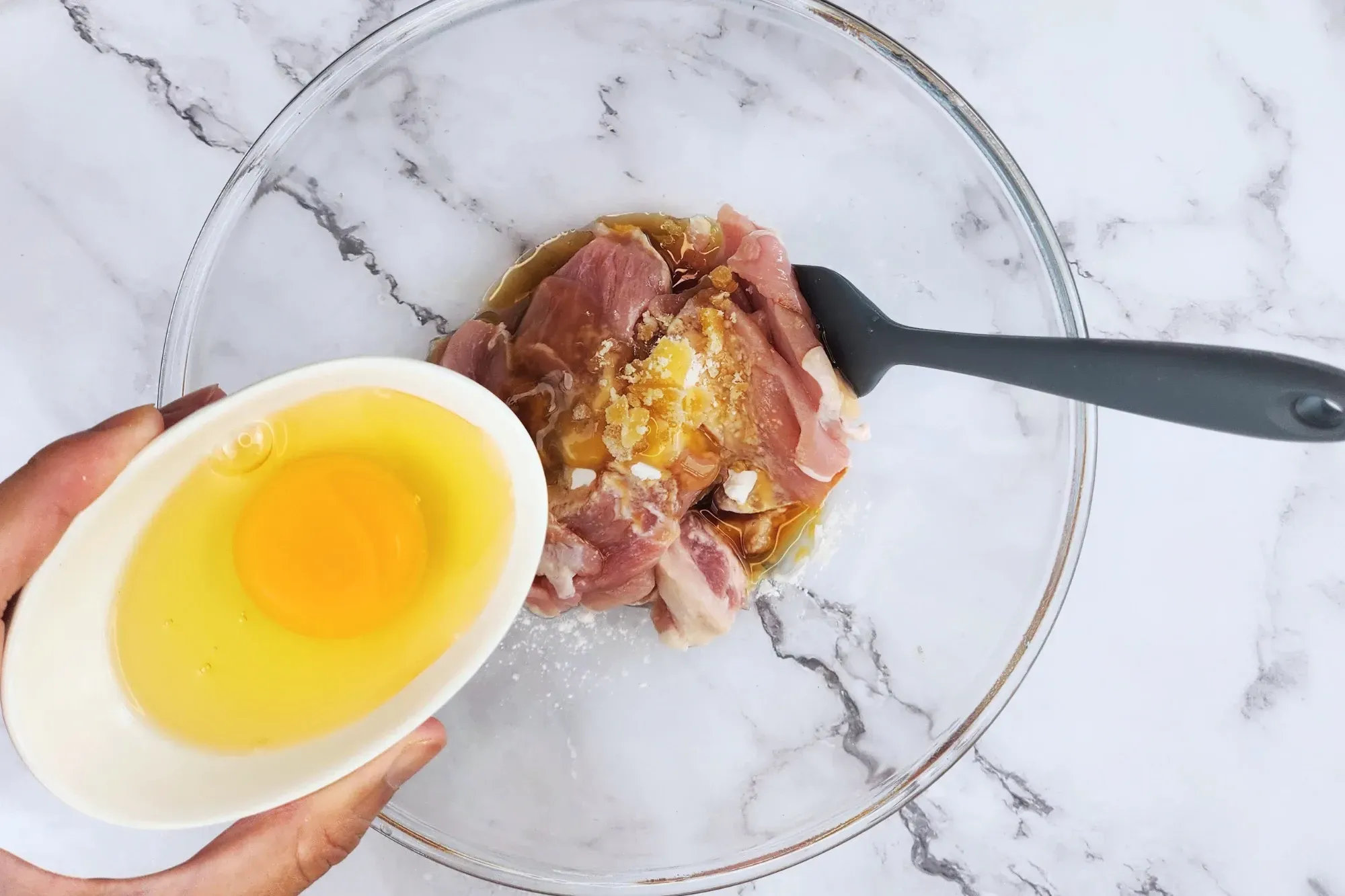 Mix sliced pork with tapioca starch, oyster sauce, light soy sauce, sesame oil, palm sugar, egg
