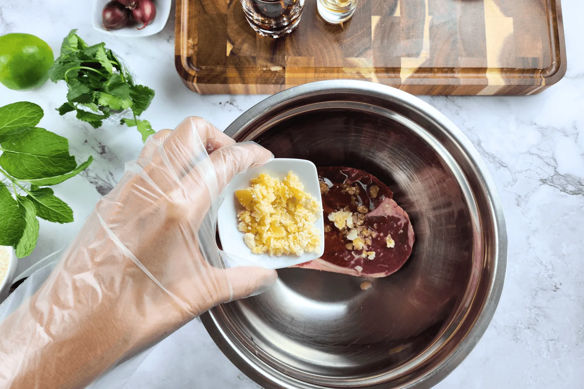 Mix the beef with oyster sauce, fish sauce, and palm sugar.