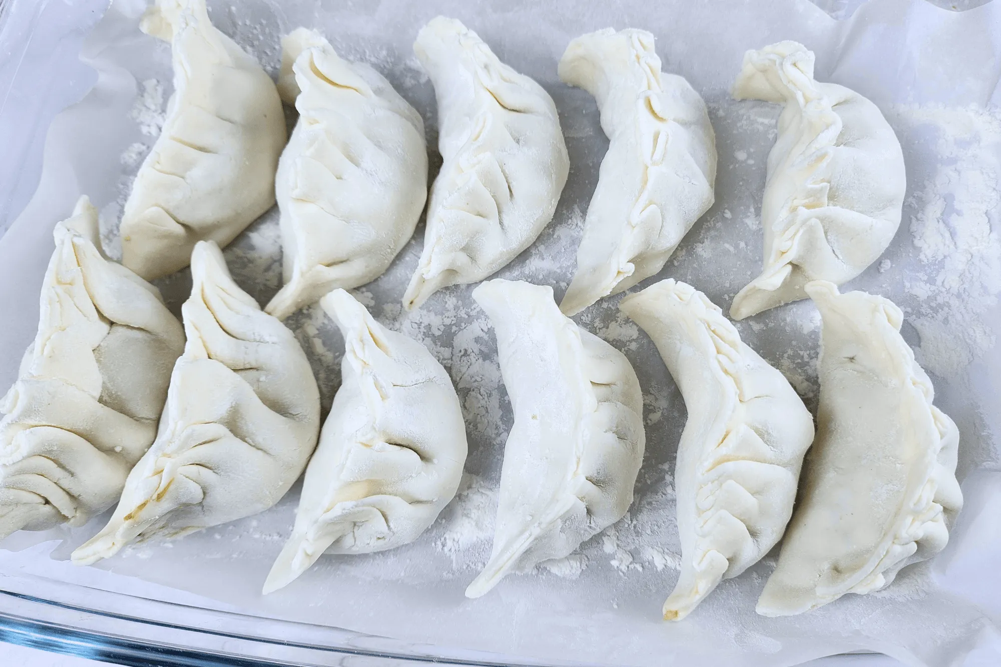 Now you should have a lovely crescent-shaped dumpling with pleats along the edge.