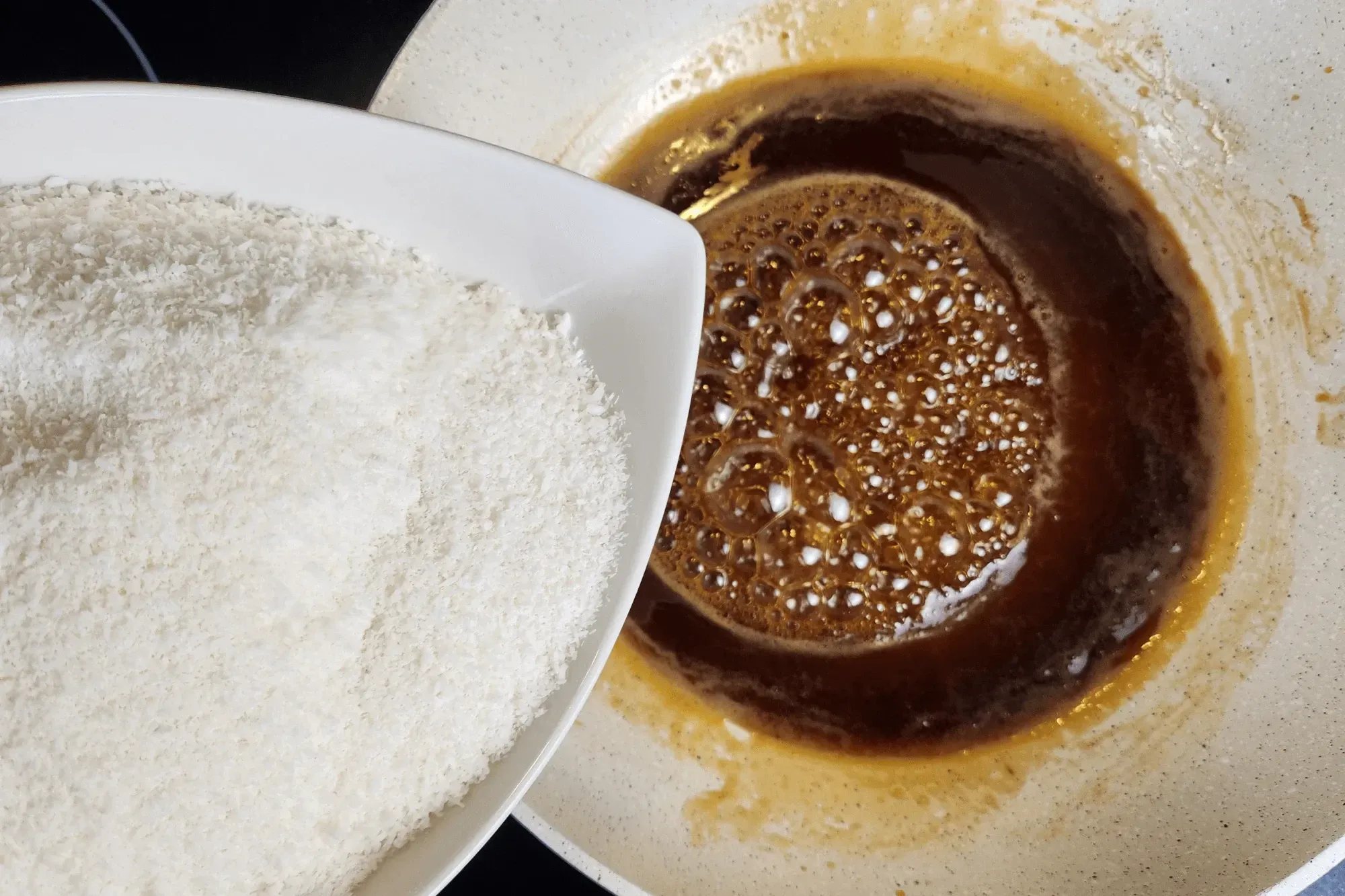 Once it boils, add shredded coconut.
