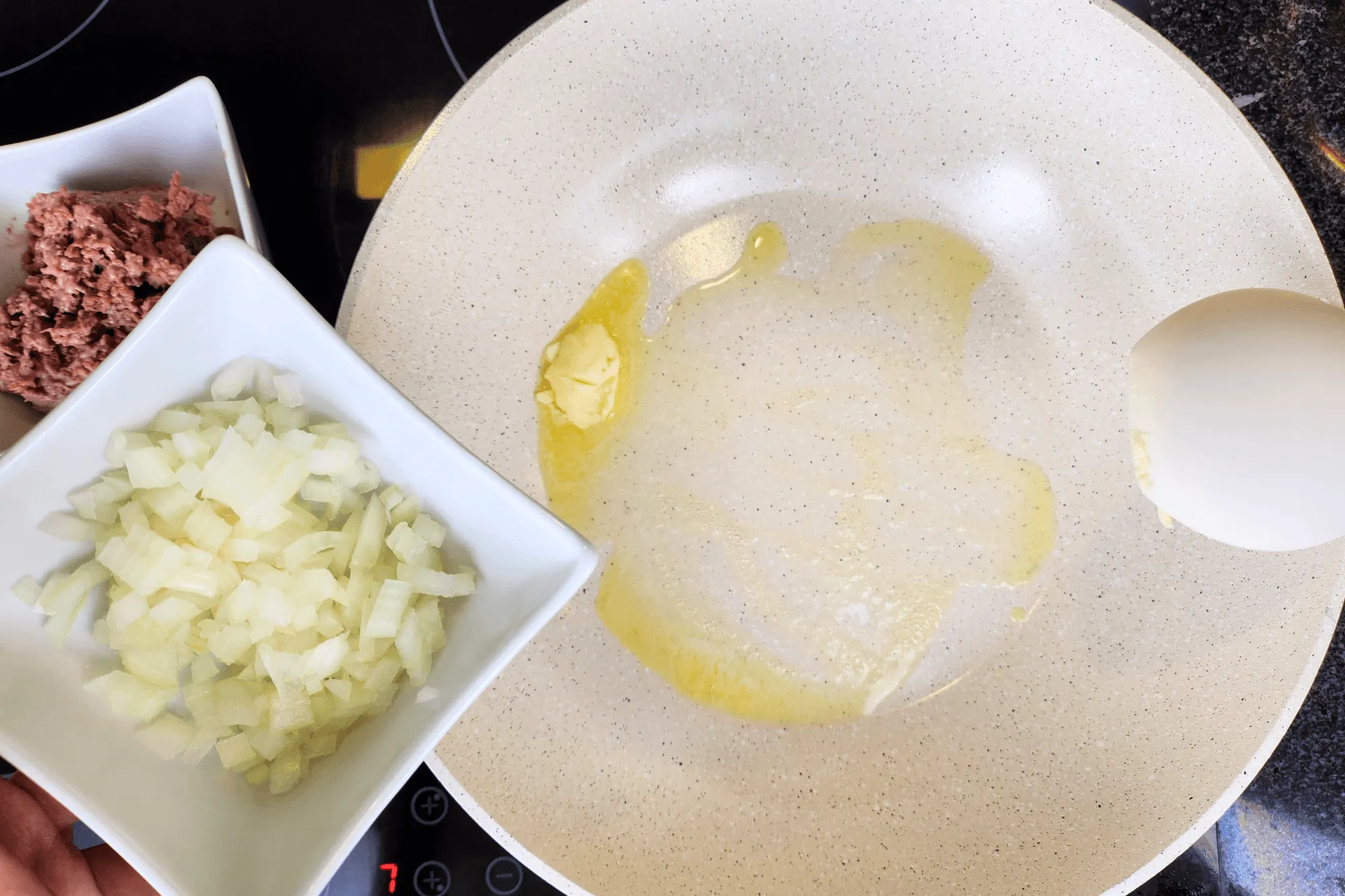 Once the butter melts, add the chopped onion