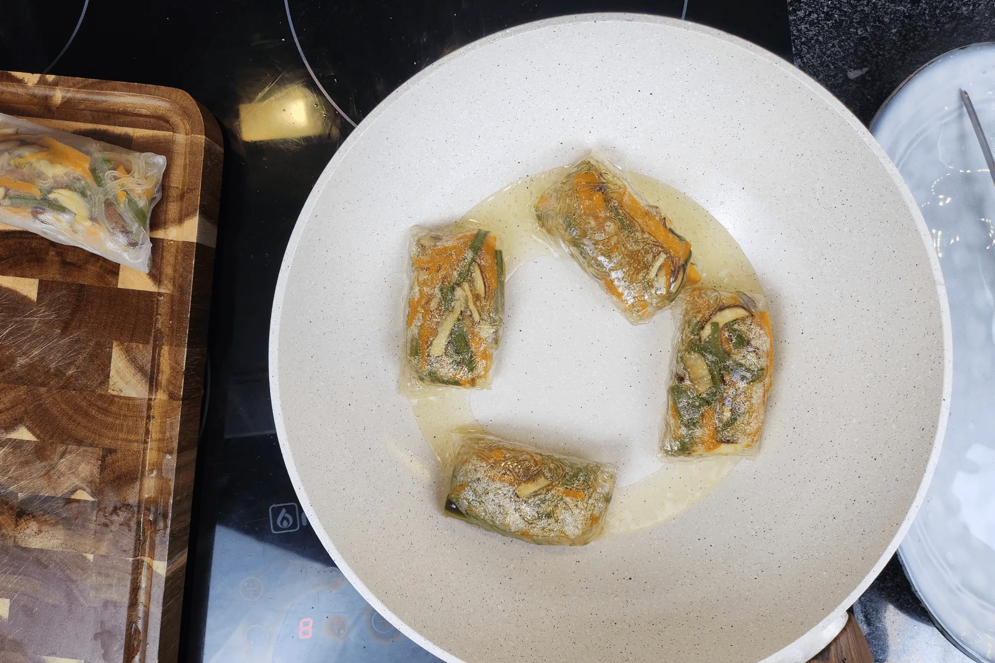 Place the dumplings in the pan and fry for about 2 minutes on each side, or until golden and crispy.