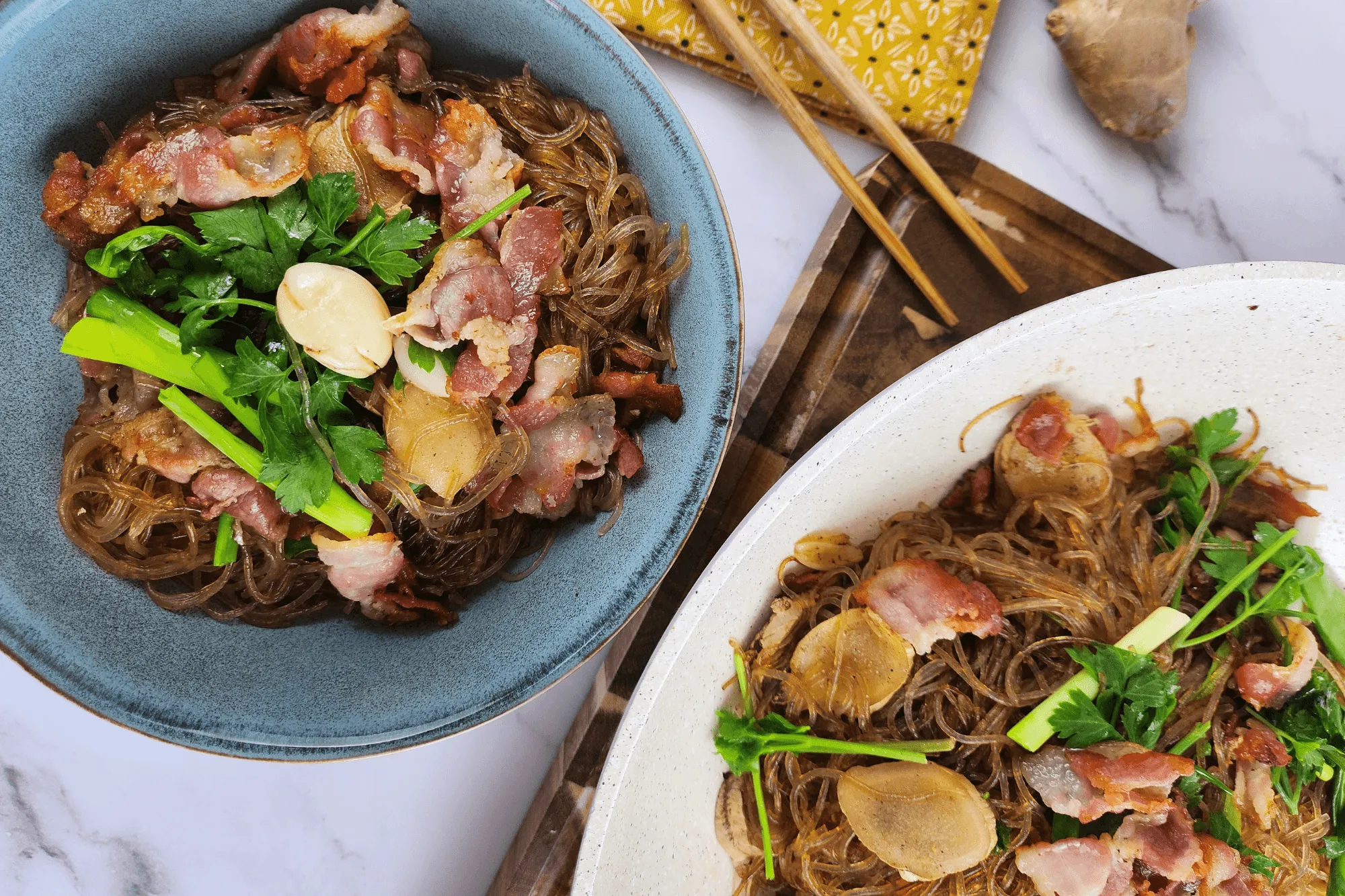 Plate the noodles, garnish with crispy bacon, and sprinkle extra Chinese celery on top. 