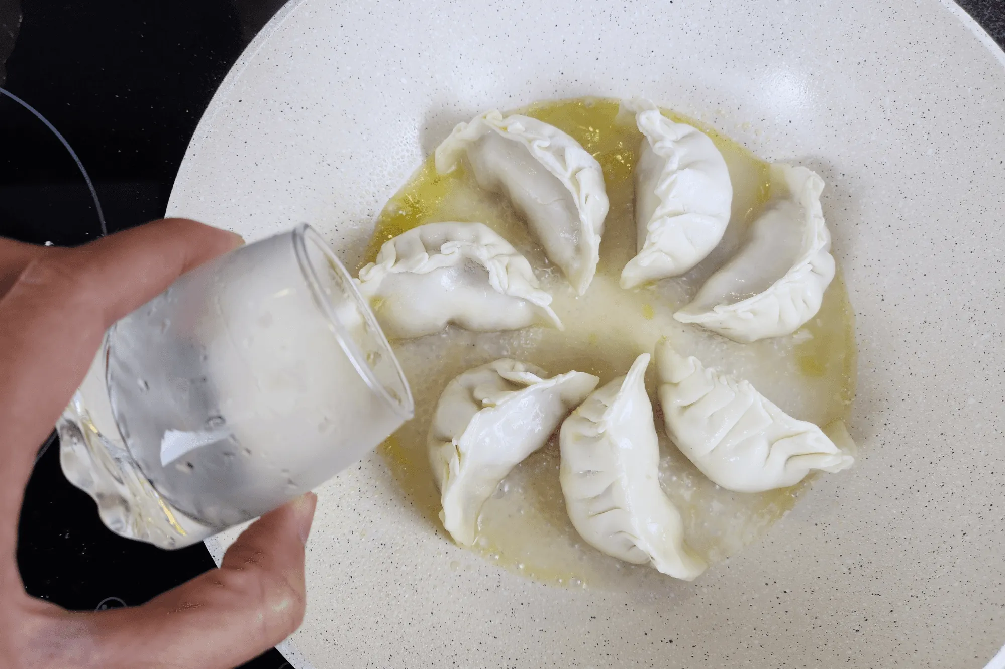 Pour ¼ cup of water into the pan 