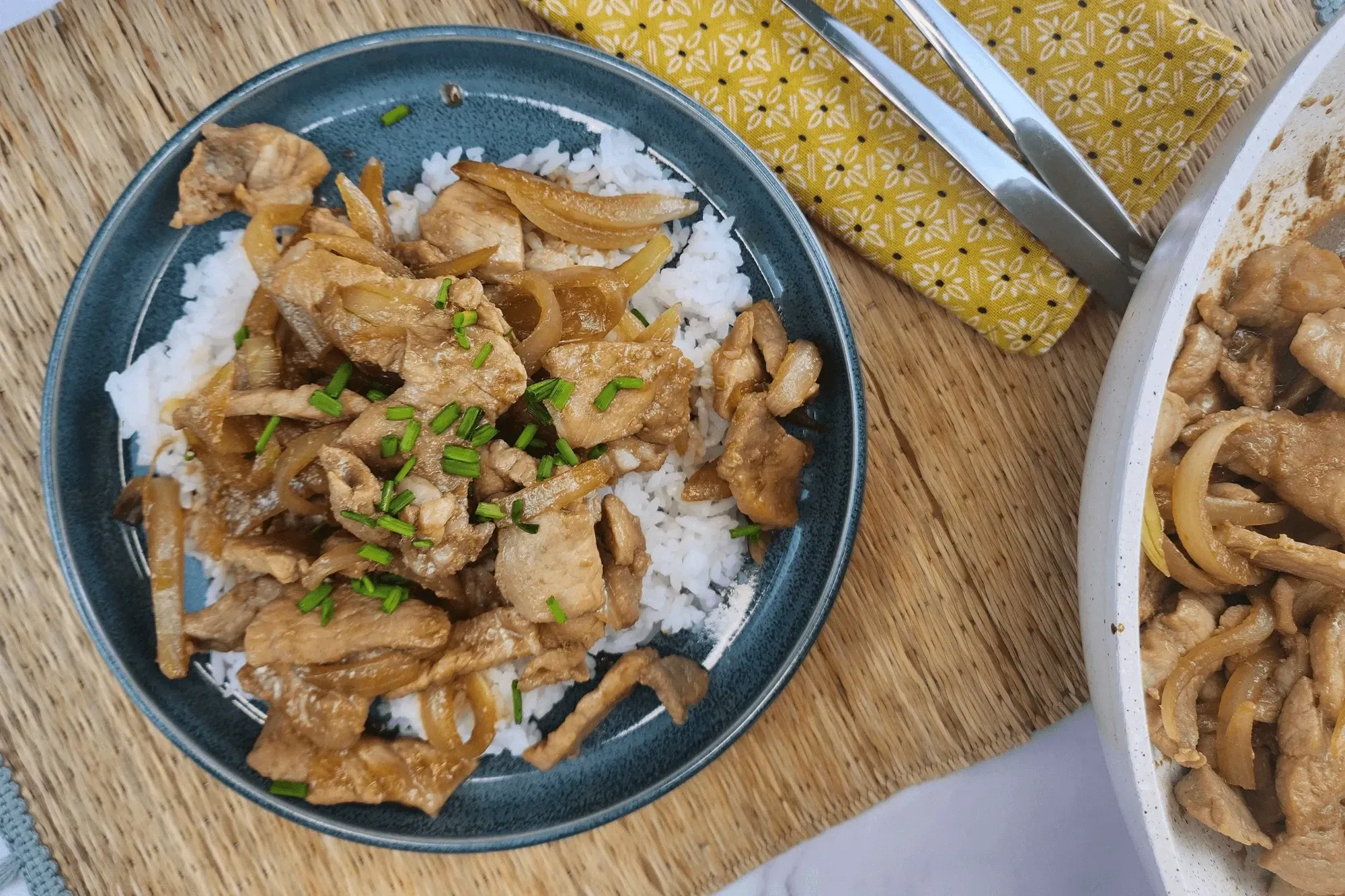 Serve hot with steamed rice and garnish with chopped scallions. Enjoy!