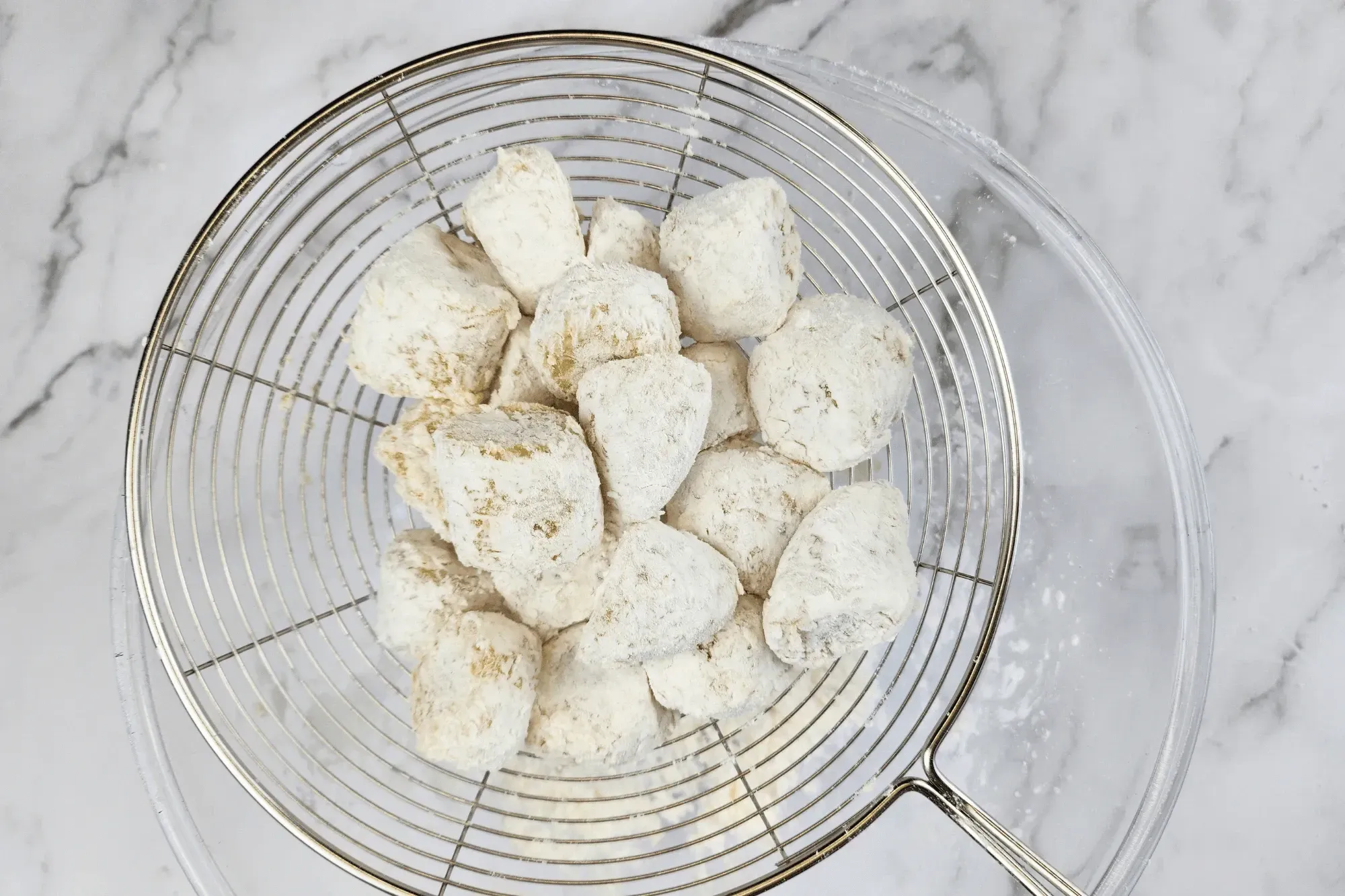 Shake off any excess starch to prevent the coconut milk mixture from becoming too thick.