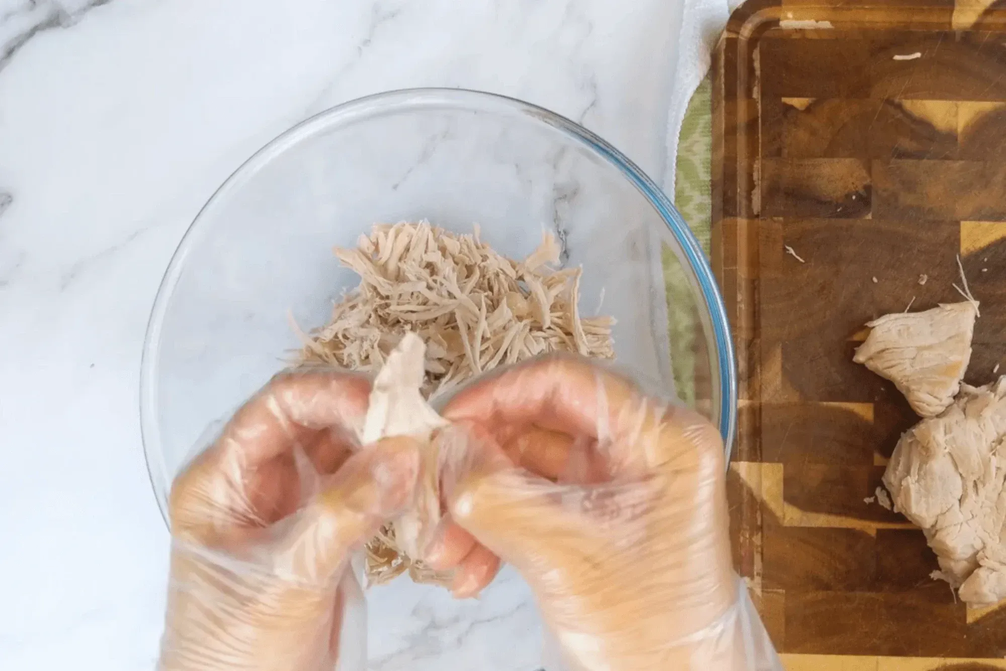 shredding pork into thin strips